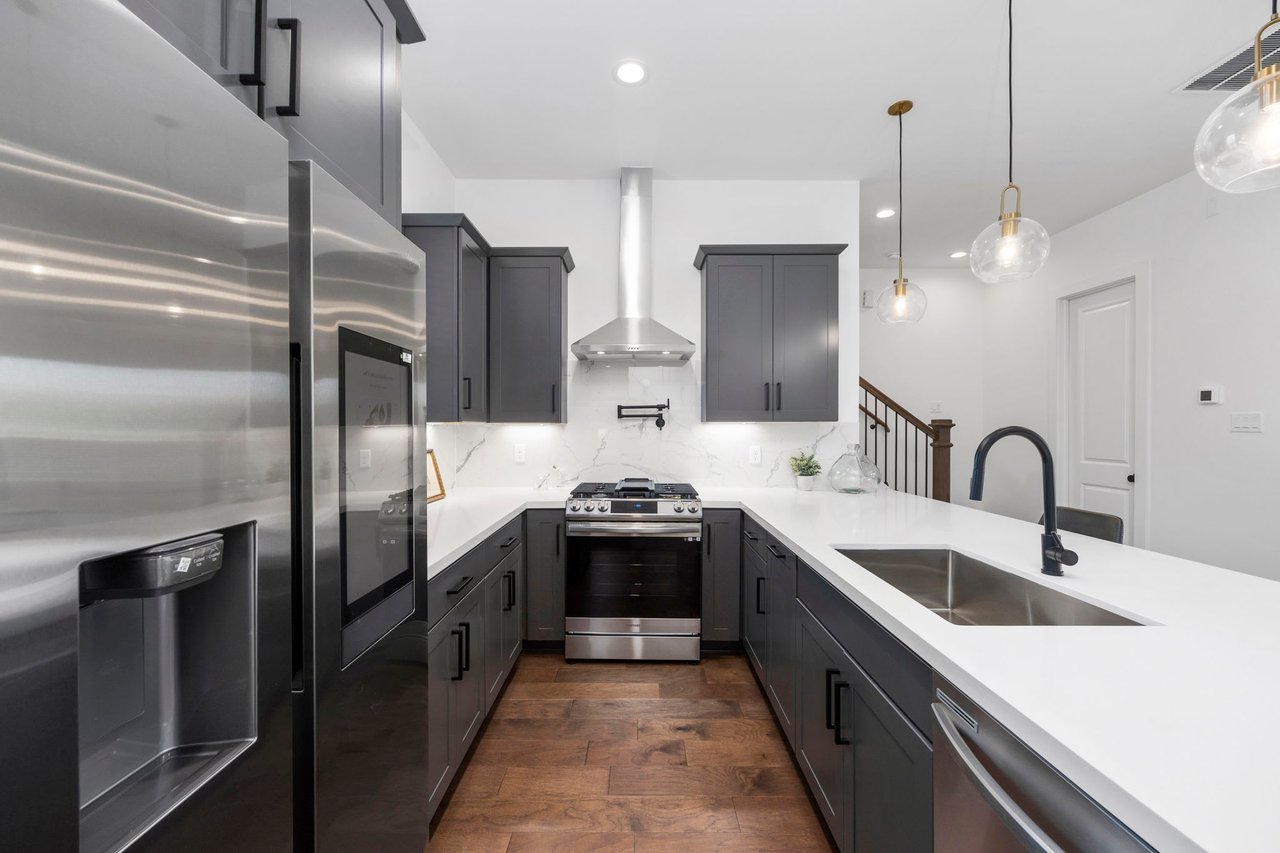 kitchen with gray cabinets and steel appliances