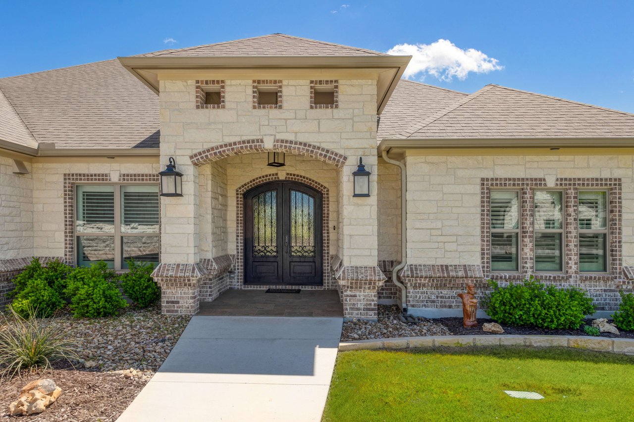 Upon entering, you'll immediately be enchanted by the charm of plantation shutters gracing each window, providing a sense of privacy and tranquility.