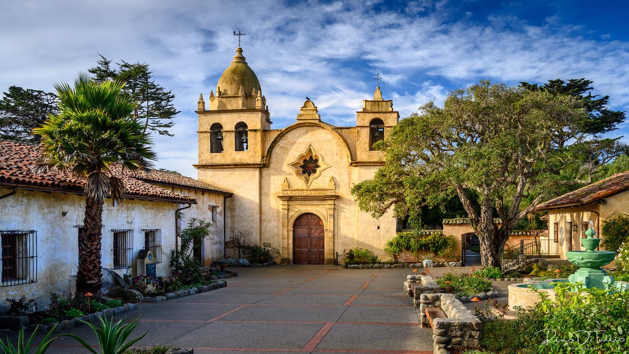 A wide-angle photo of the Carmel Mission Basilica.