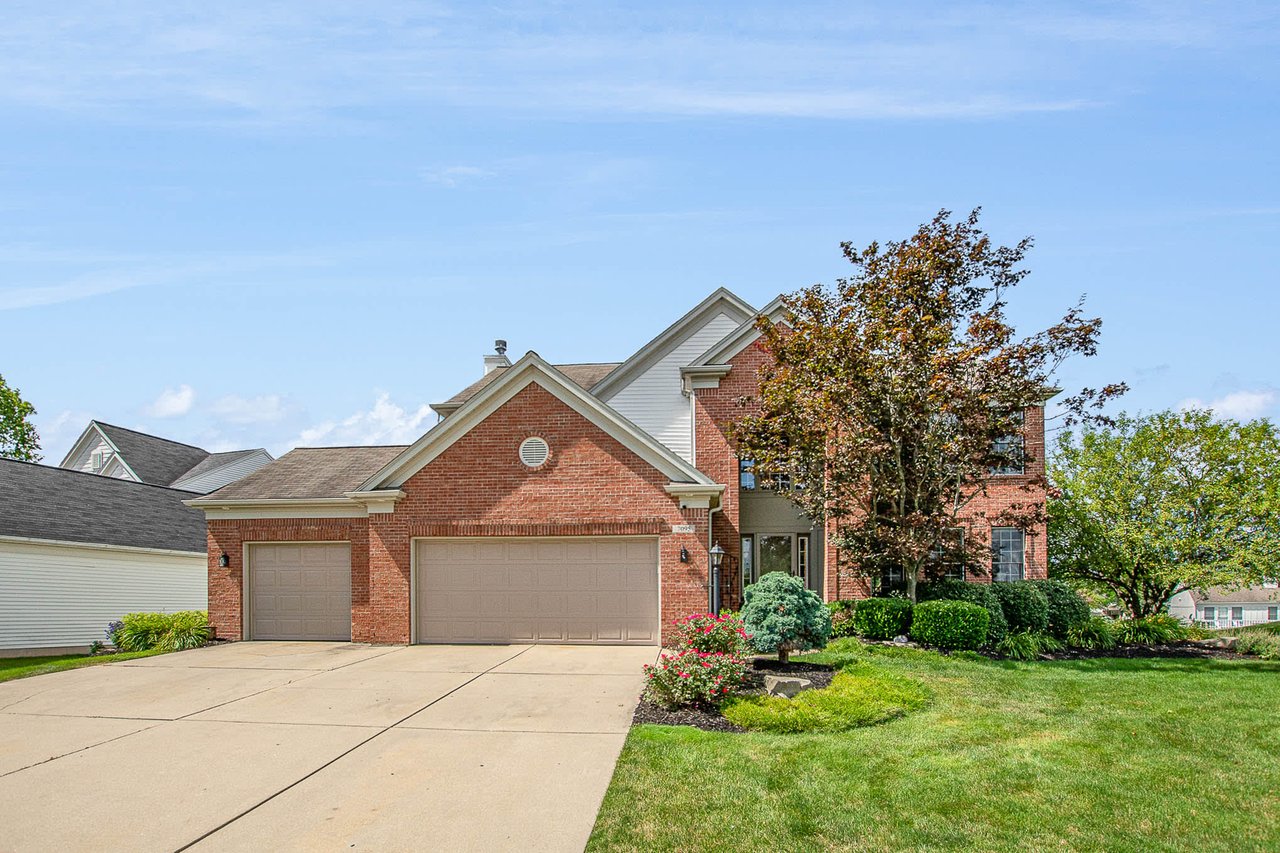 a modern brick exterior house with driveway in Caledonia