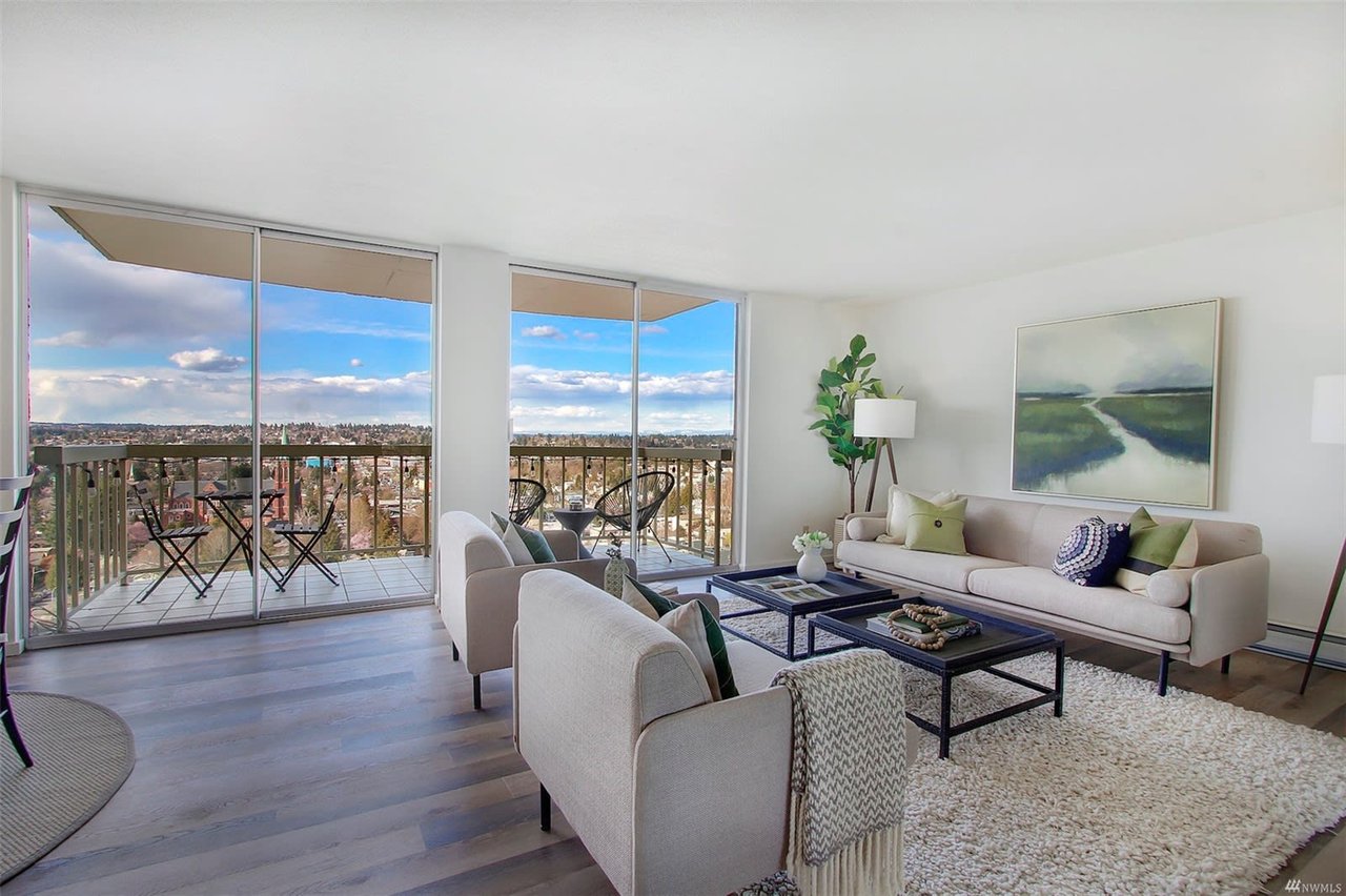 Inviting and serene luxury condo living room with elegant decor and sweeping views, perfect for upscale living.