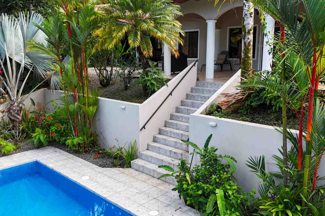 Turnkey Spacious Home with Open Layout, Pool & Small Ocean View in Ojochal Gated Community