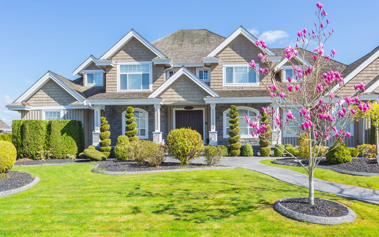 front yard landscaping with lakehouse and blue sky