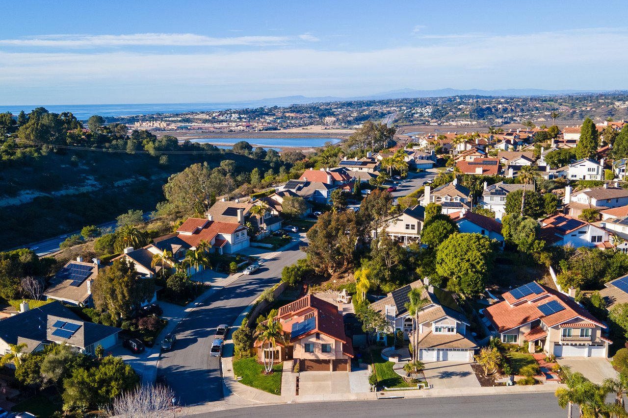 Aerial view of Carmel Valley homes near Del Mar, highlighting proximity to ocean and San Diego coastal lifestyle.