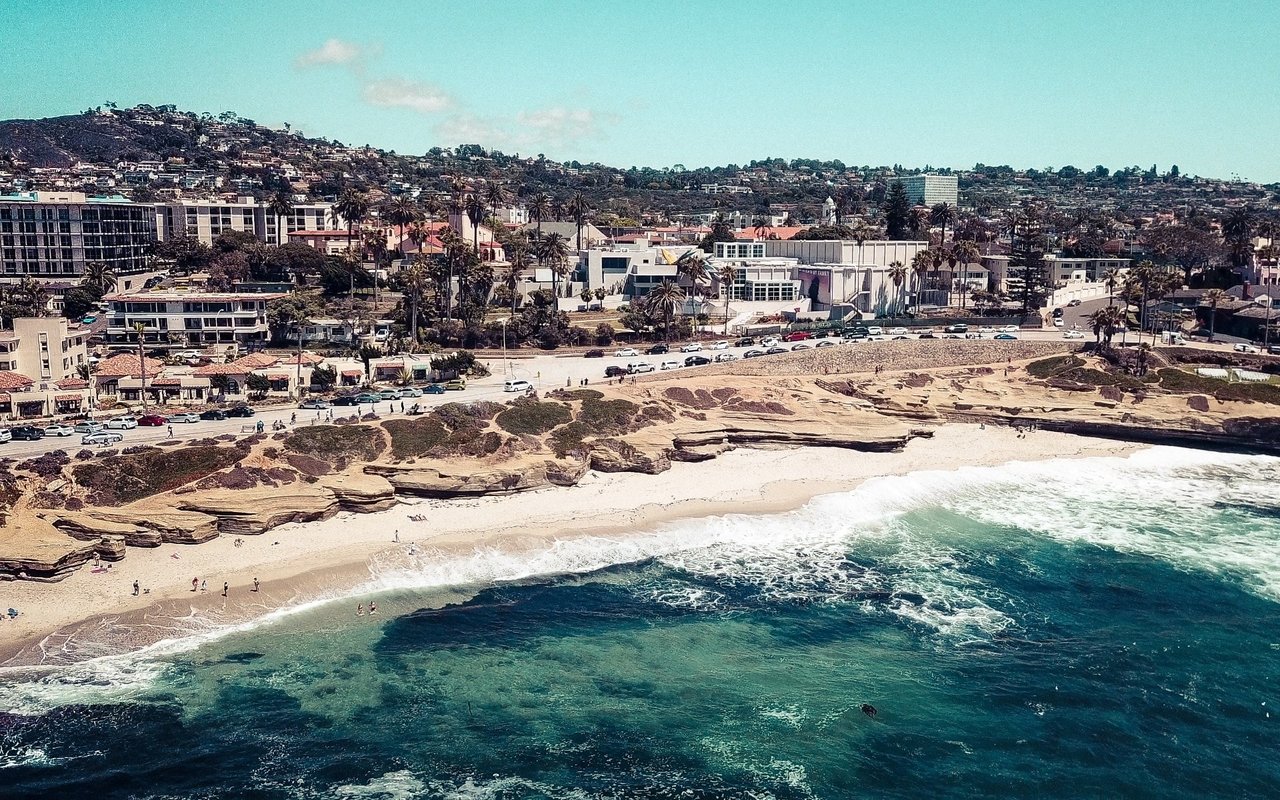 An aerial view of a beach and a city