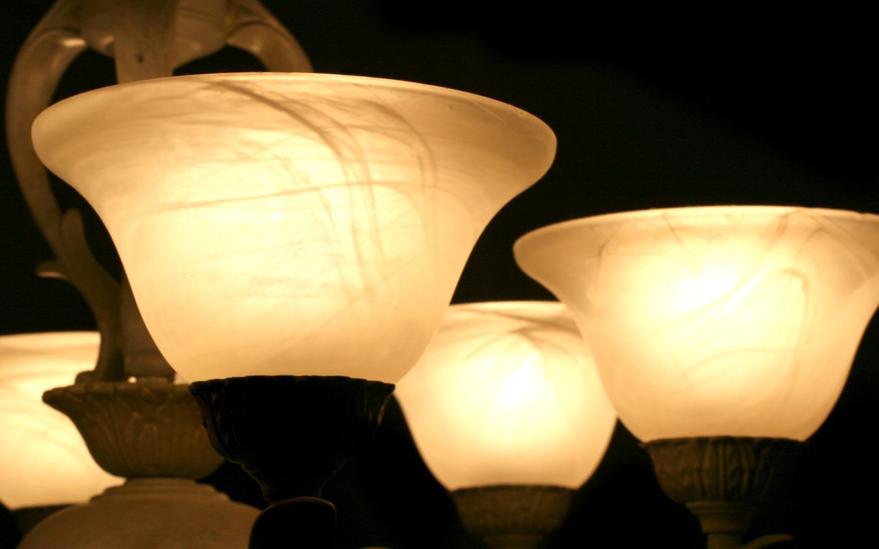 Light Fixture close up. Globes. Lit. Dining room