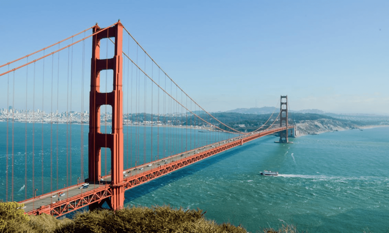 The iconic Golden Gate Bridge spans the Golden Gate strait, connecting San Francisco to Marin County