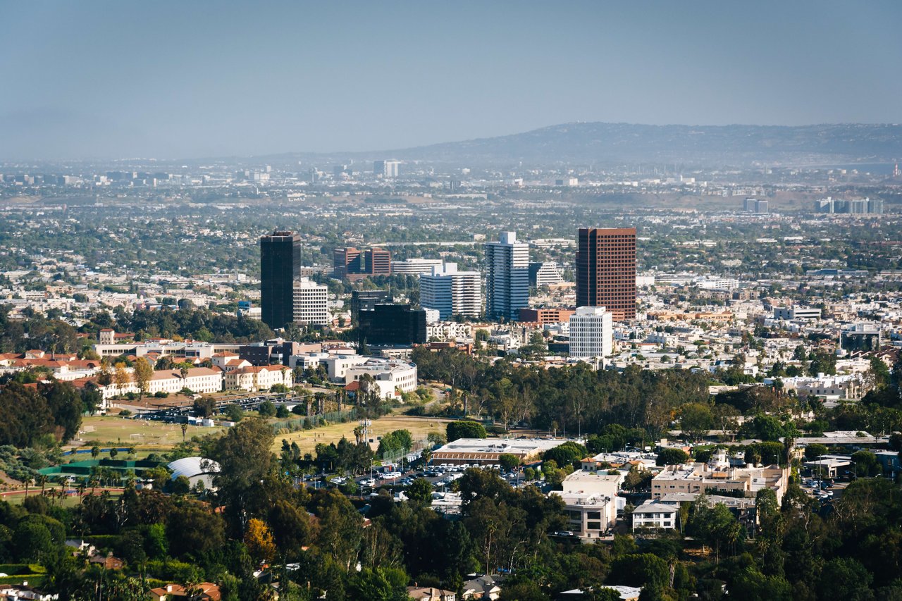 An aerial view of the city with tall buildings in the foreground