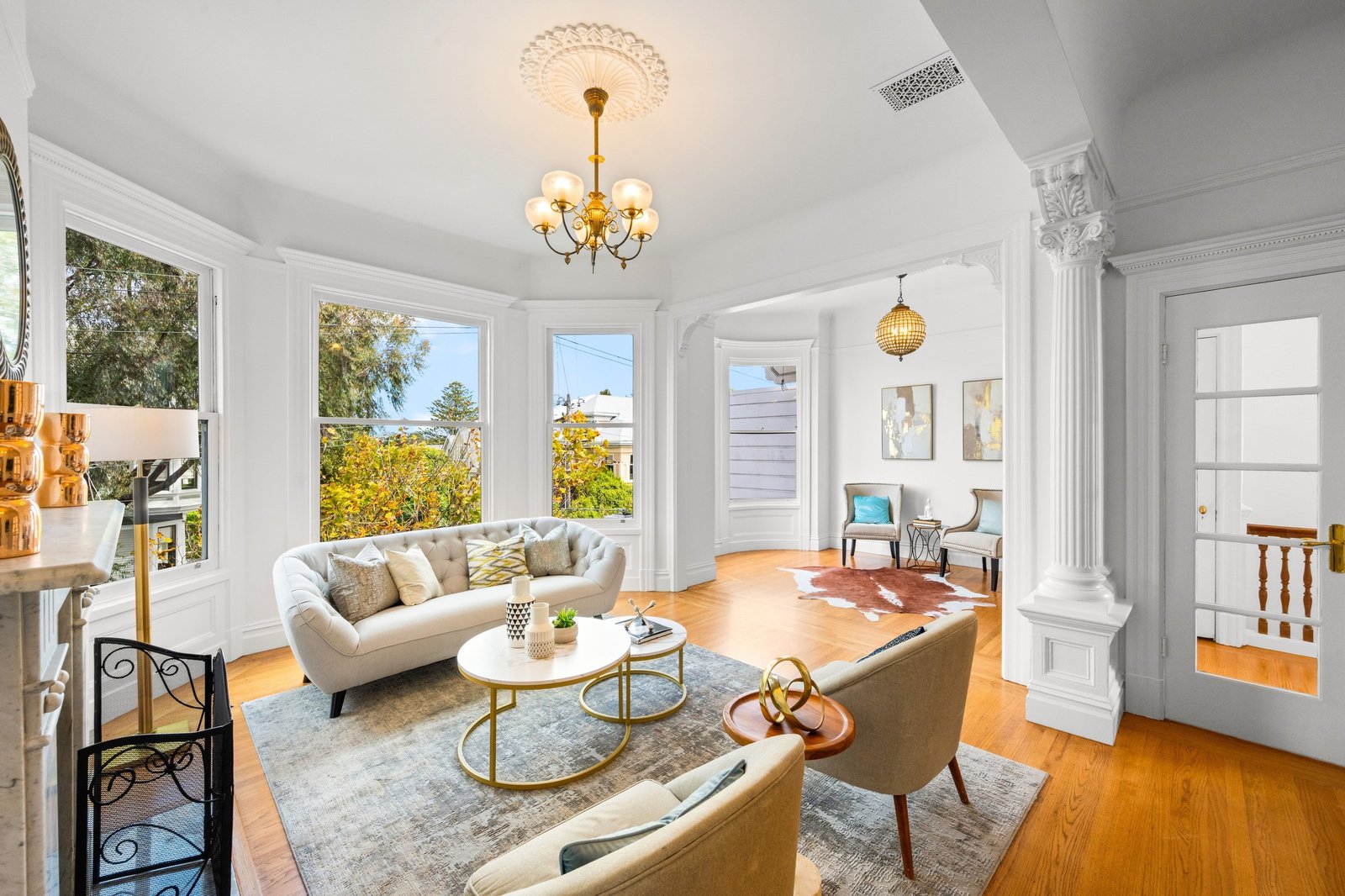Bay window sitting area with chandelier and hardwood floors at 449 Frederick Street, Cole Valley