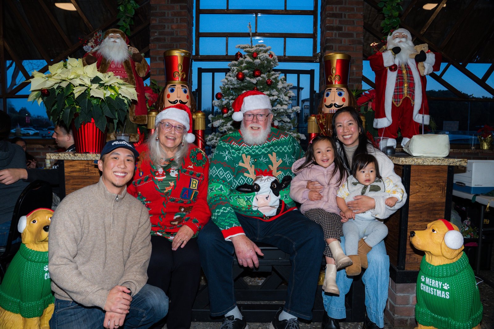 A Fremont family celebrating with Santa at Fremont Jingle 2024