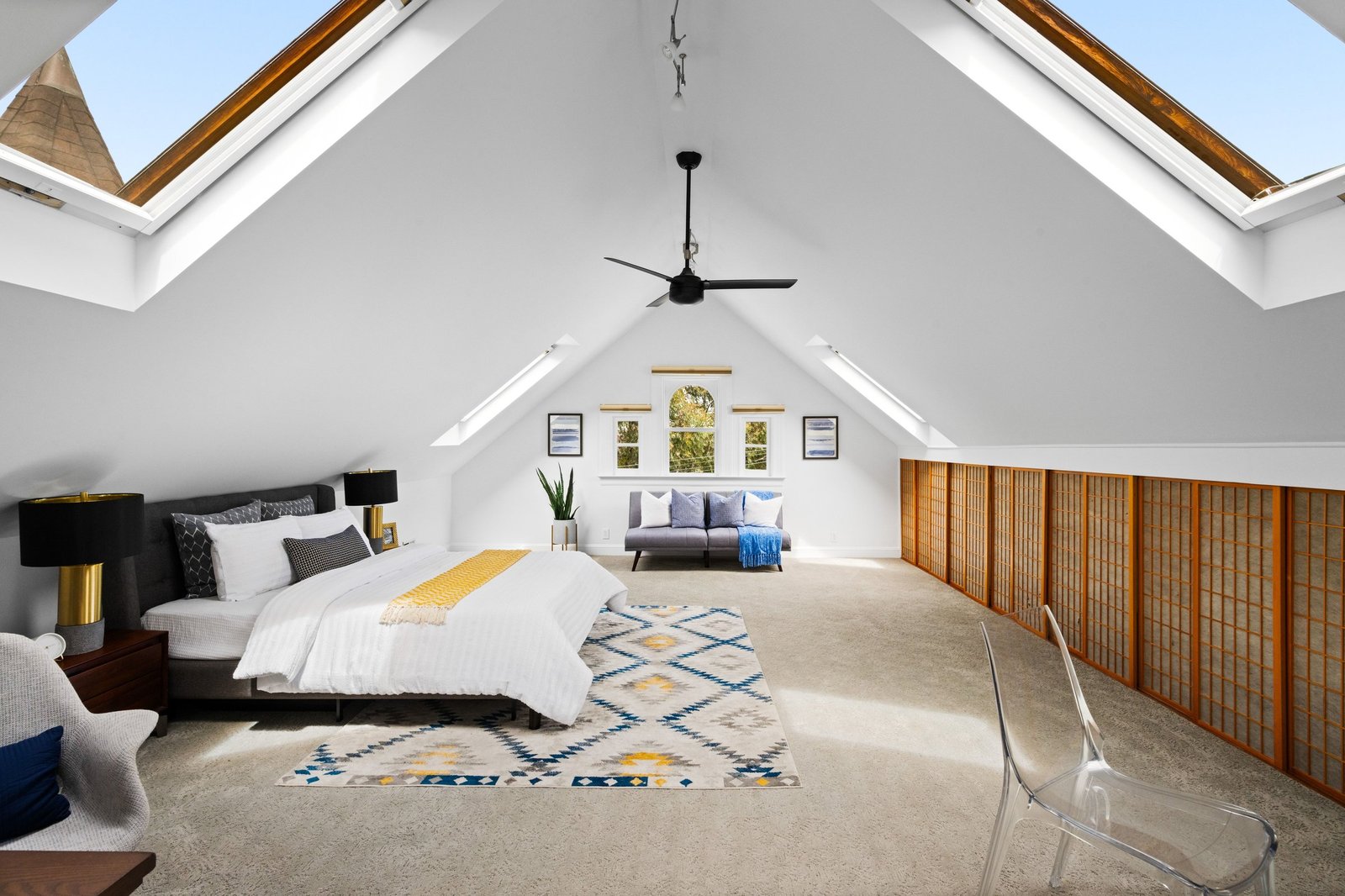 Oversized primary bedroom with vaulted ceiling and skylights at 449 Frederick Street, San Francisco