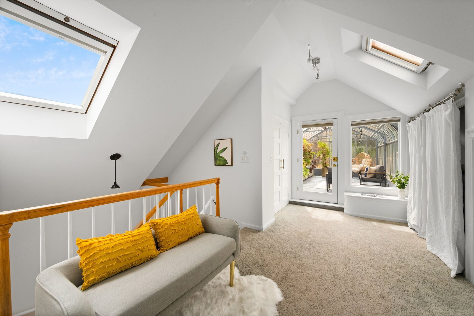 Flexible bonus space with skylight and seating at the upper landing of 449 Frederick Street