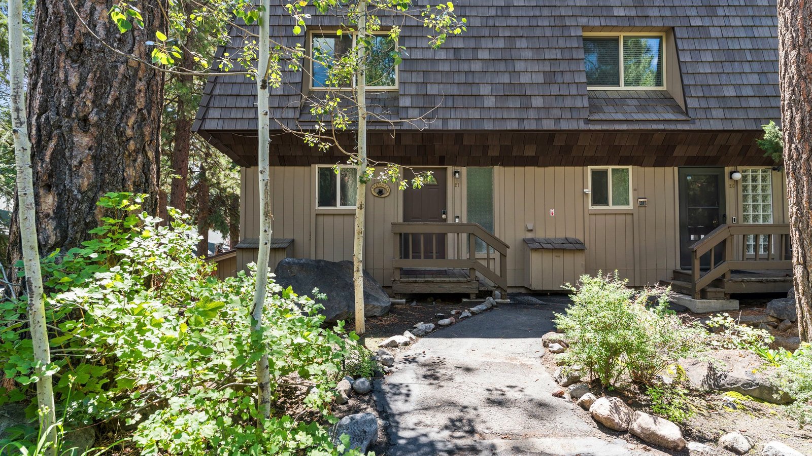 Shingled two-story condominiums among pines and aspens at 861 Southwood Boulevard in Central Incline Village