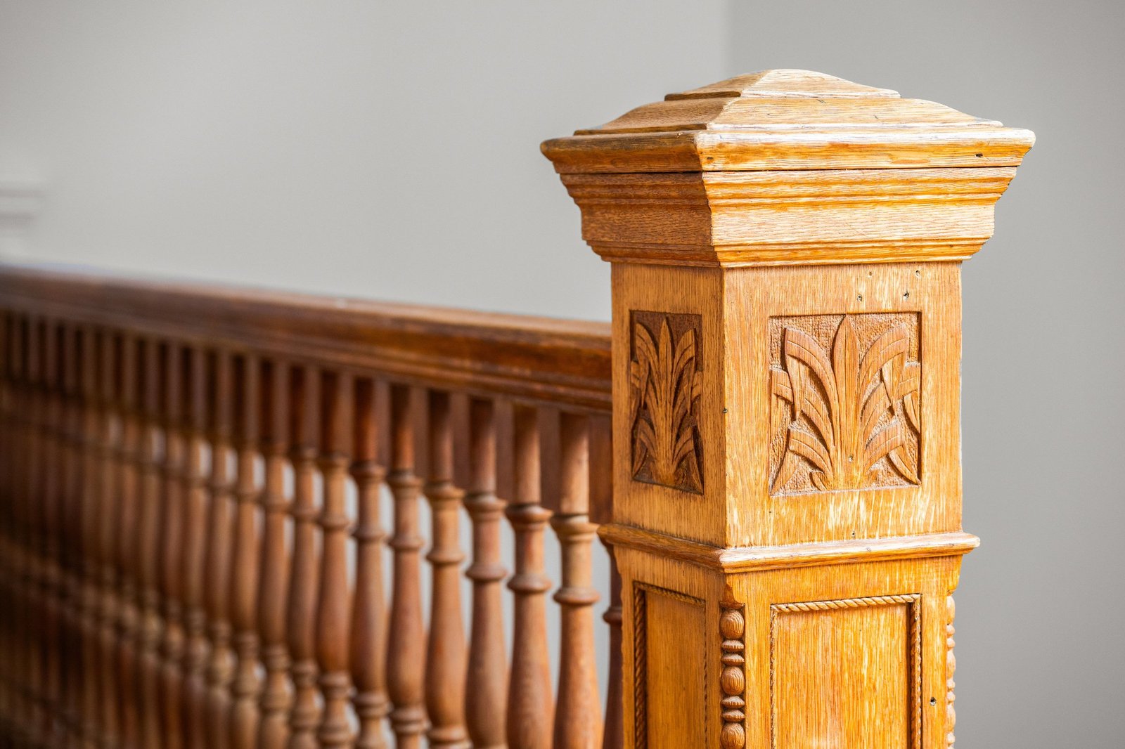 Carved oak newel post and turned banister, original 1898 detail at 449 Frederick Street