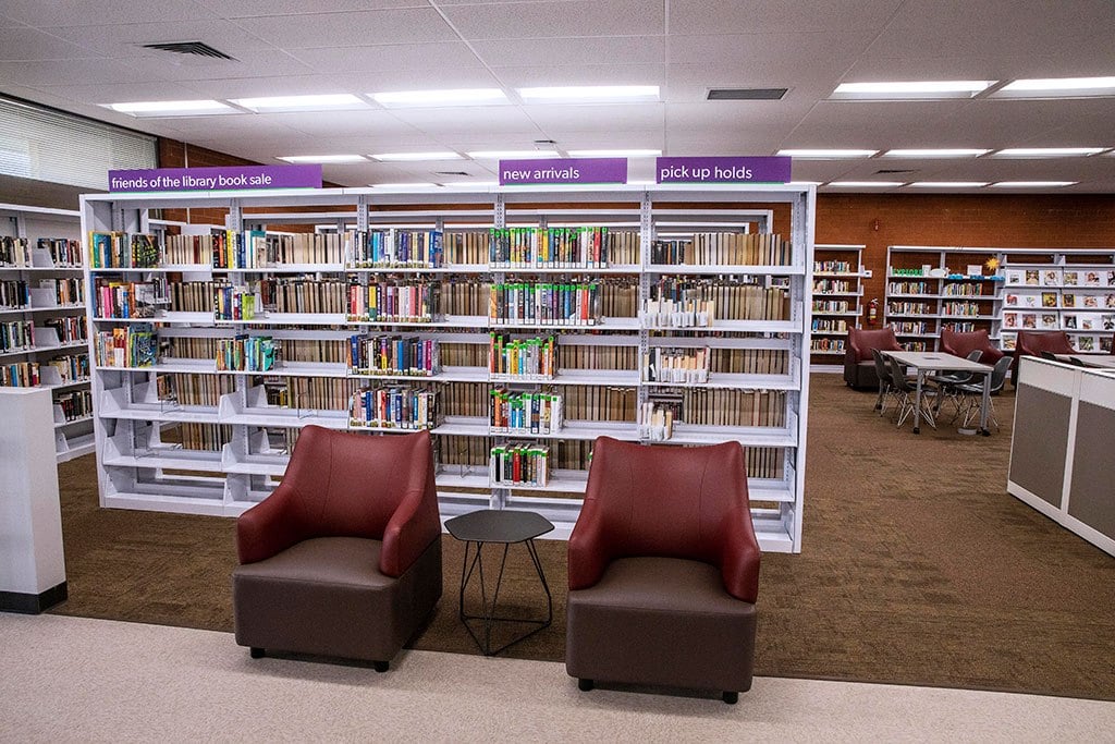 Reading chairs and book shelves inside Hollydale Library in South Gate