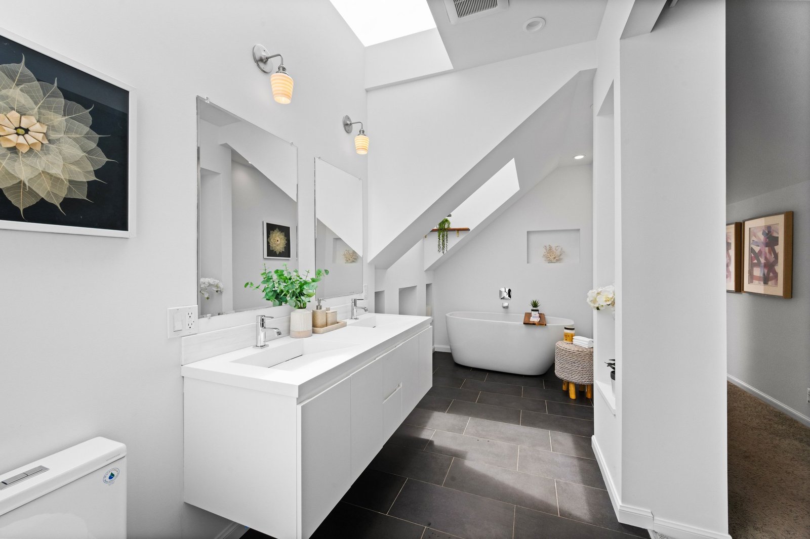 Spa-like primary bath with double vanity and freestanding soaking tub at 449 Frederick Street