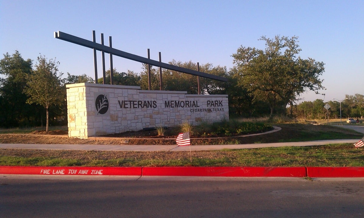 Veterans Memorial Park entrance sign and monument wall in Cedar Park, Texas