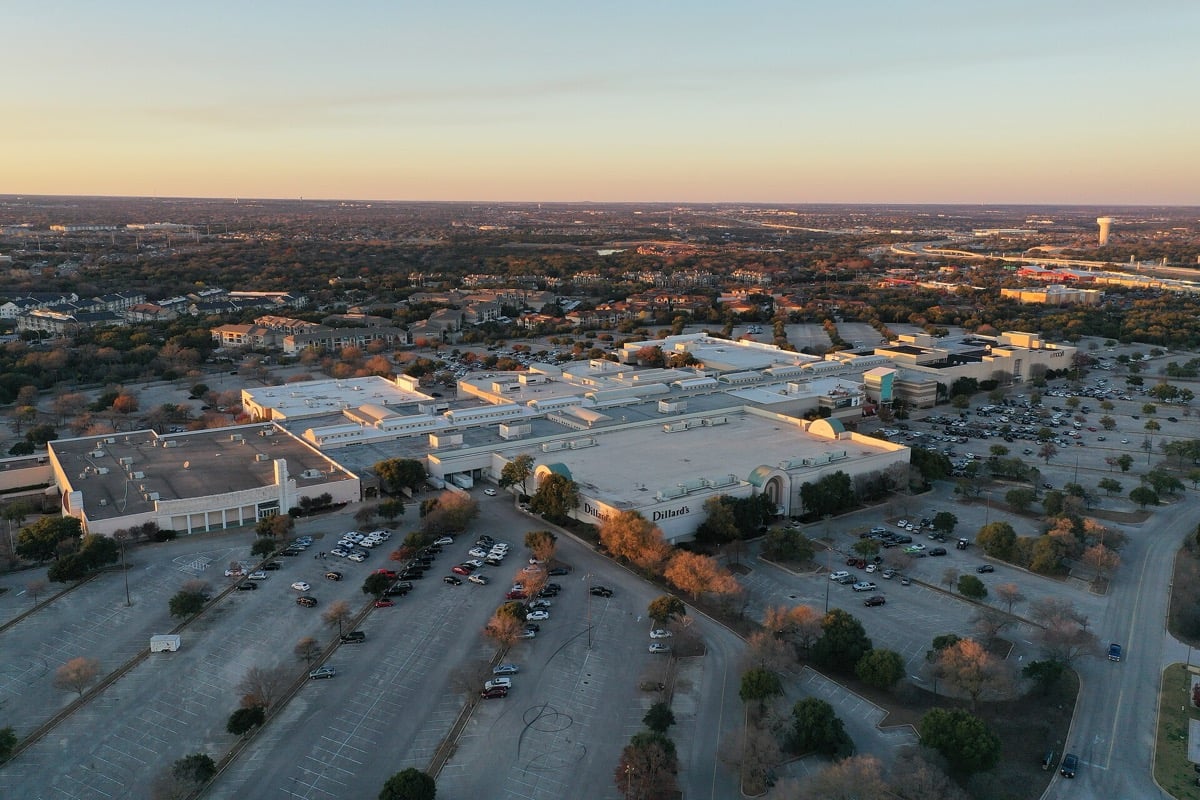 Aerial view of Lakeline Mall and surrounding roads at dusk