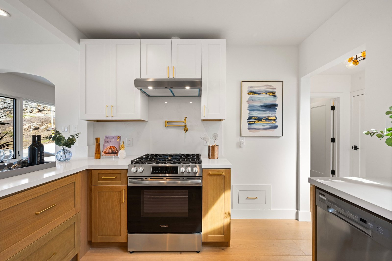 Kitchen range and hood with stainless appliances at 15 Shields Street, San Francisco
