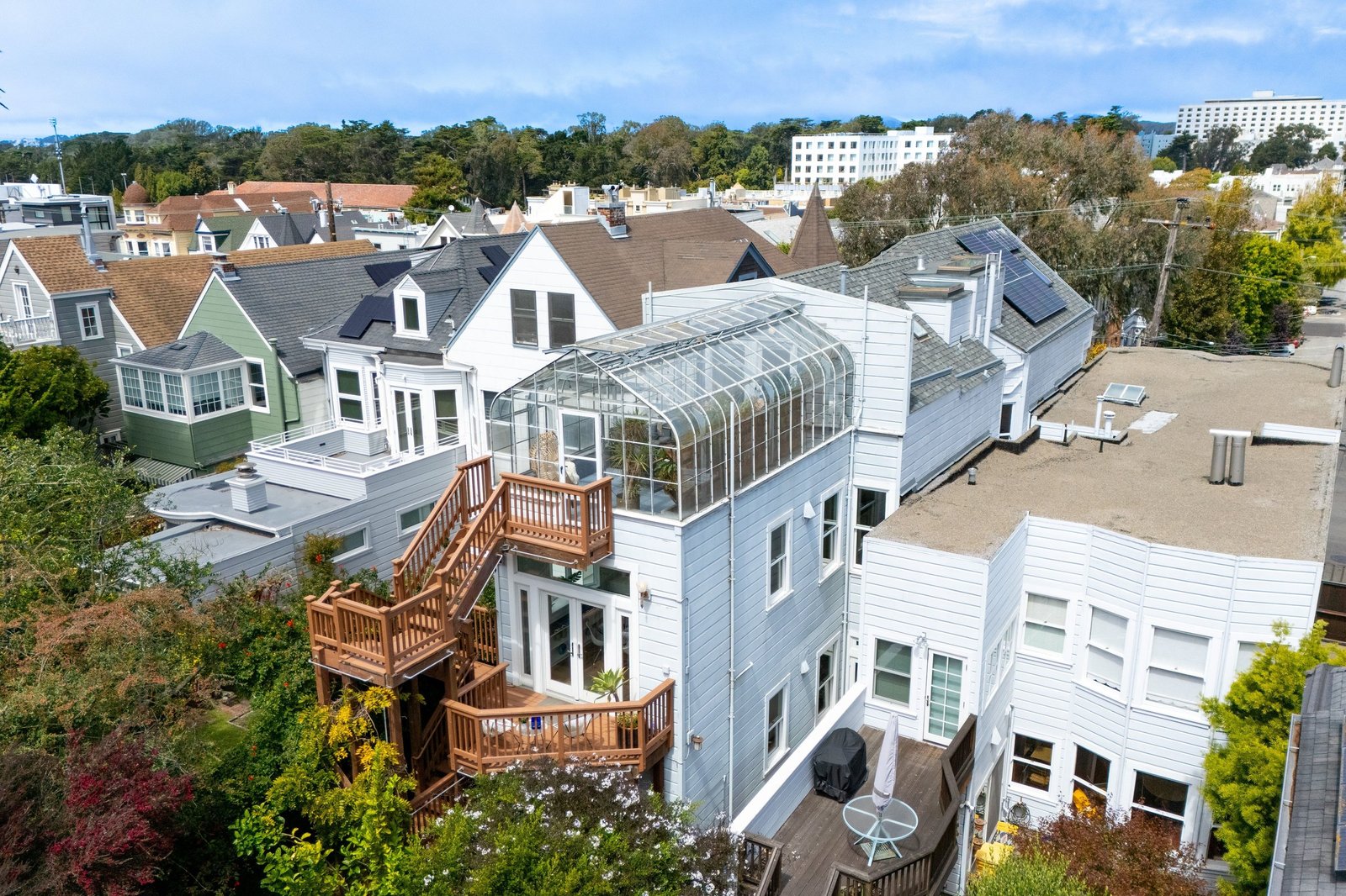 Aerial view showing the rooftop greenhouse and rear decks at 449 Frederick Street, Cole Valley