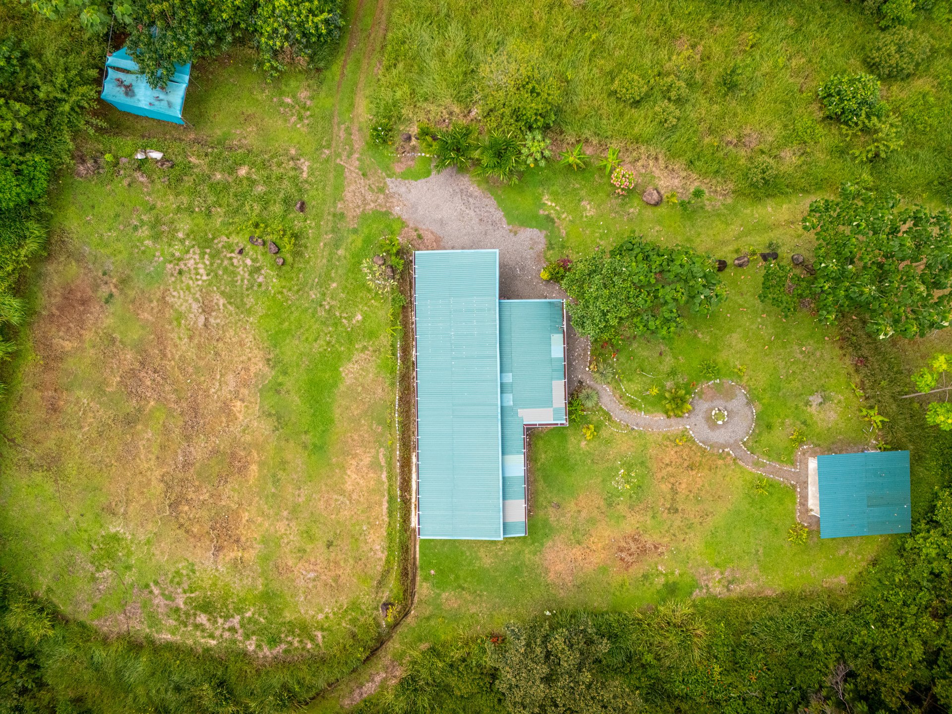 Plant Your Roots at Tierra Bendita! 2.5 Acres, River Frontage, 2 Bedroom Home, Private, Easy Access!