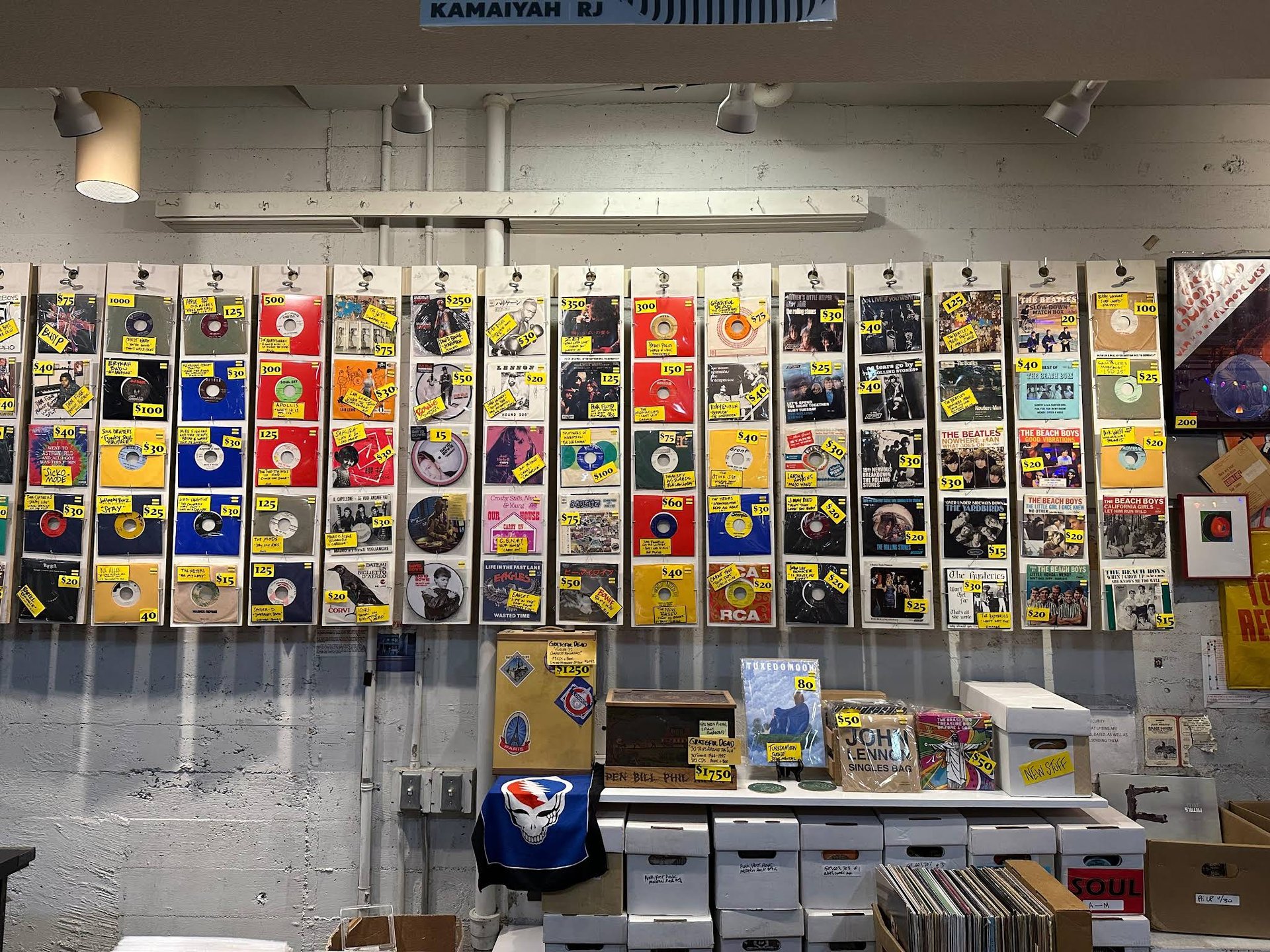 Vinyl Wonderland: Music lovers browse the vast collection of records lining the walls at Amoeba Music's Haight Street location, a haven for crate diggers and audiophiles seeking new and classic sounds. Photo credit: Emily Santos.