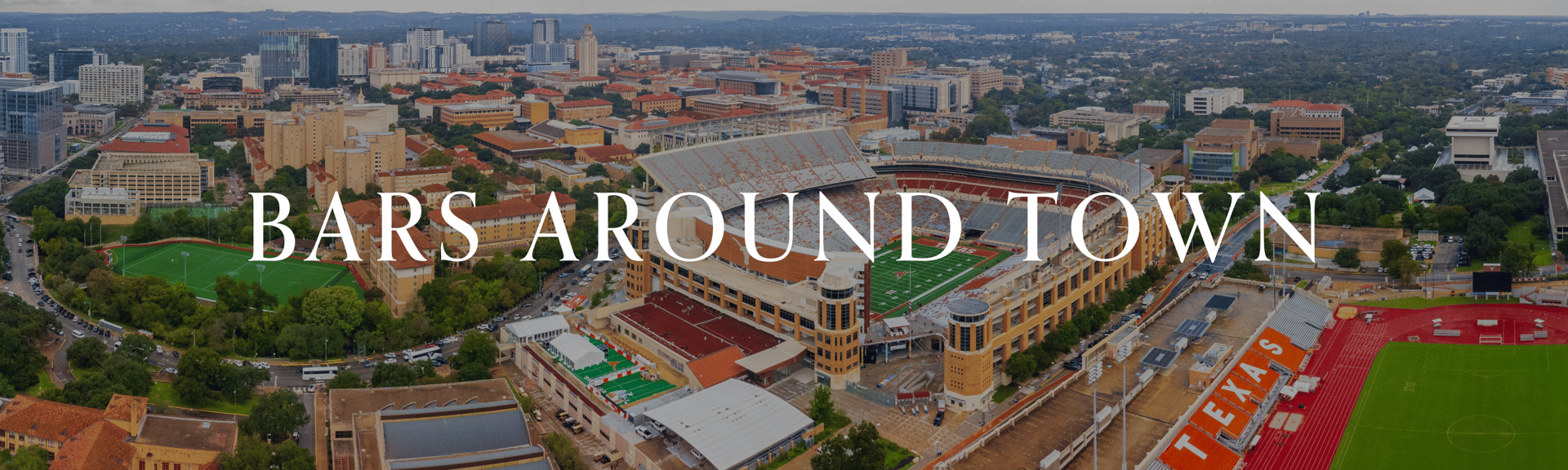 Aerial view of a cityscape featuring buildings, a sports stadium, and green spaces, with the text "BARS AROUND TOWN" overlaying the image.