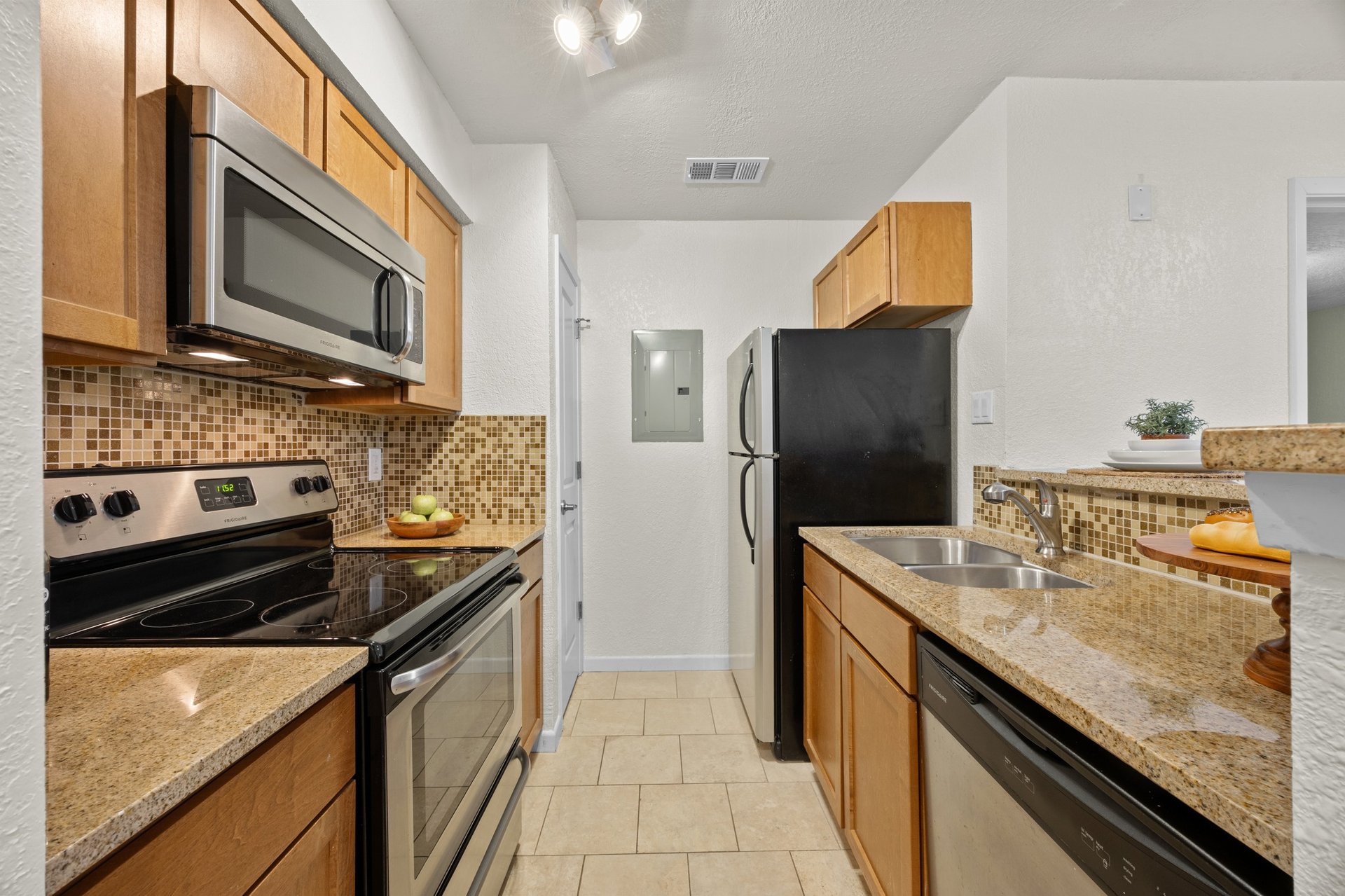 Top-Floor Condo Retreat in Gated Ivy Condos | Private Balcony + Tree-Filled Views