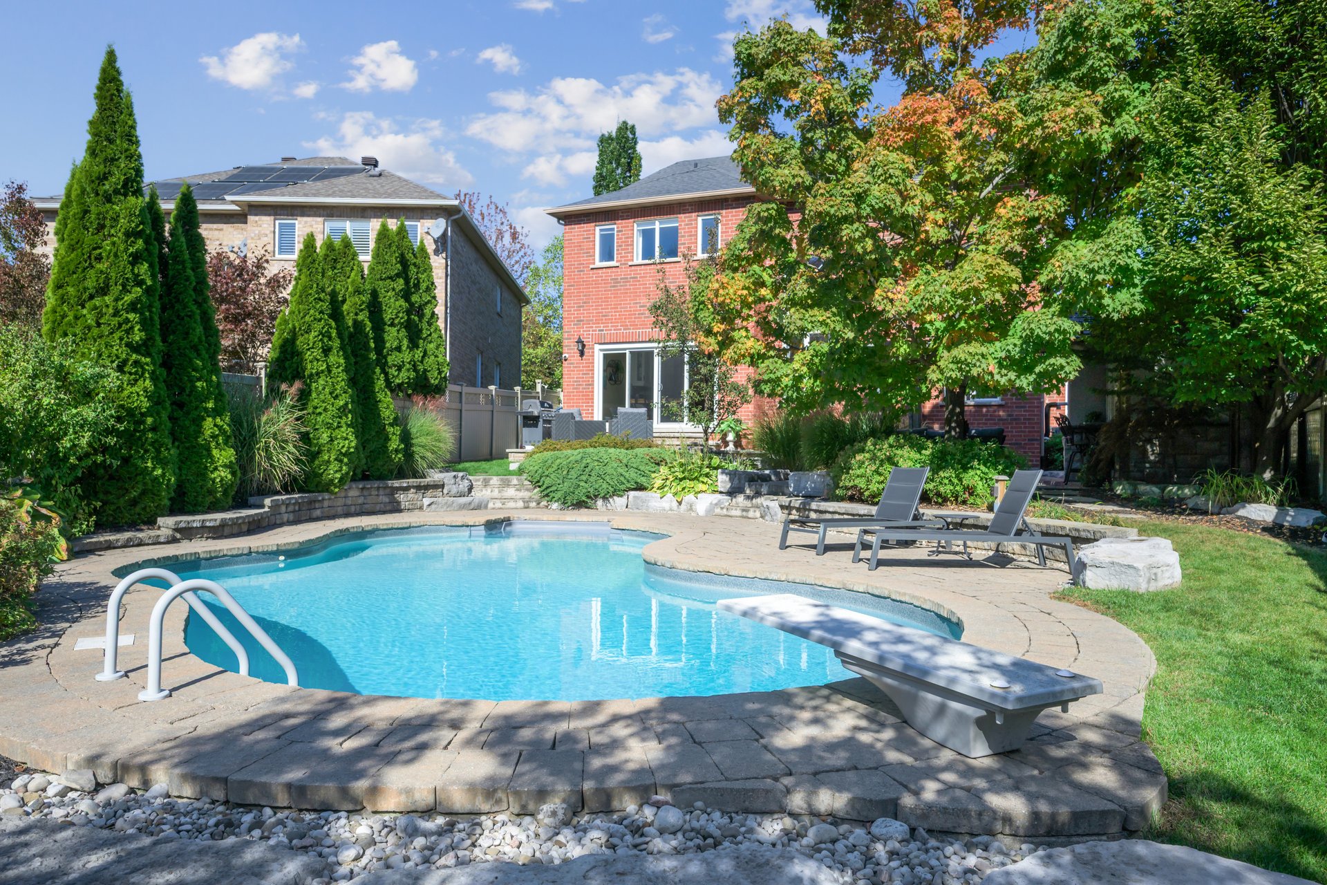 Resort-style yard backing onto lush ravine
