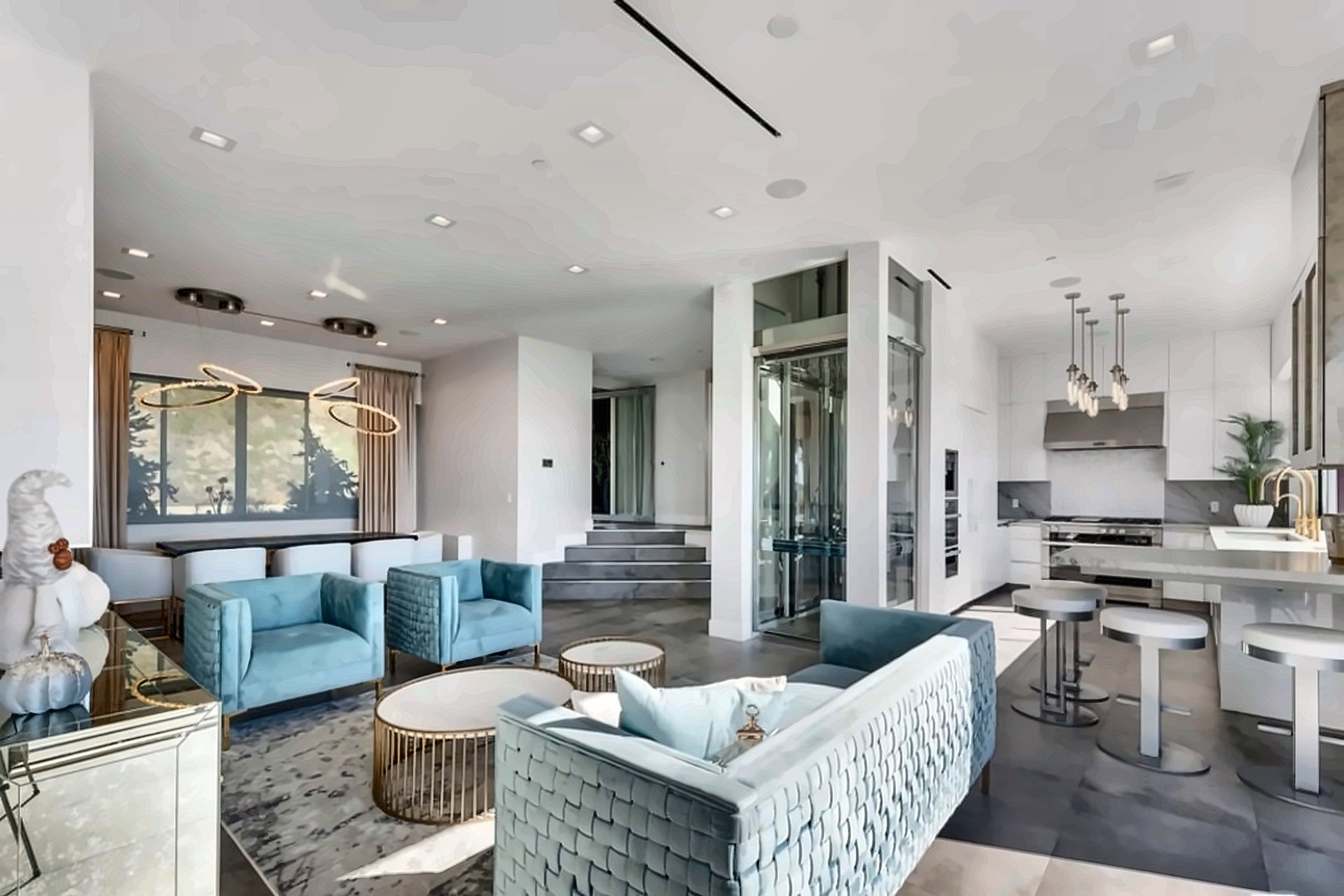 Open-plan living room with modern furnishings in a newly built Malibu home
