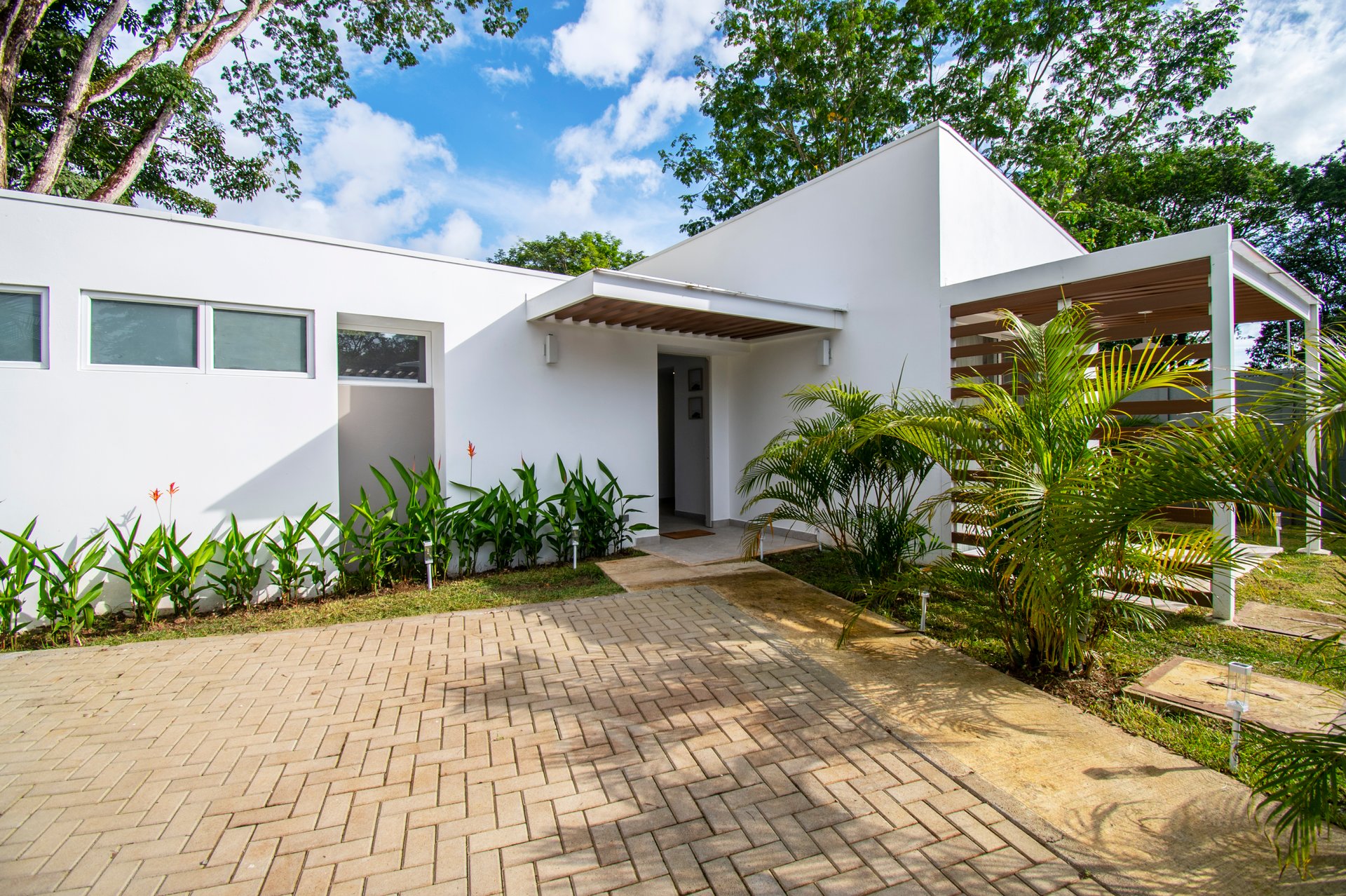Turnkey Tropical Home Steps from the Beach