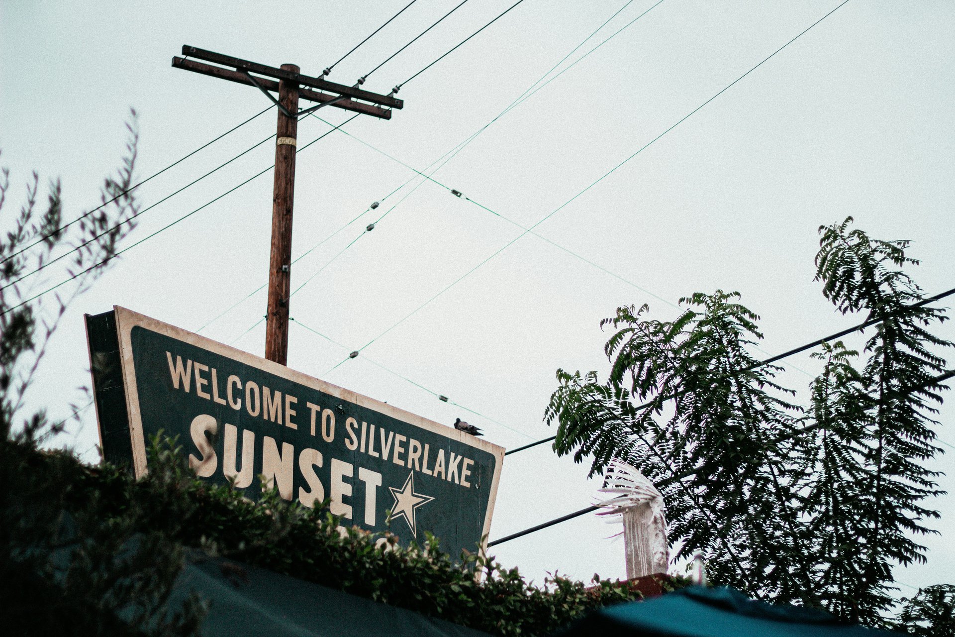 Welcome to the Silverlake Sunset Junction sign in Silver Lake Los Angeles at dusk