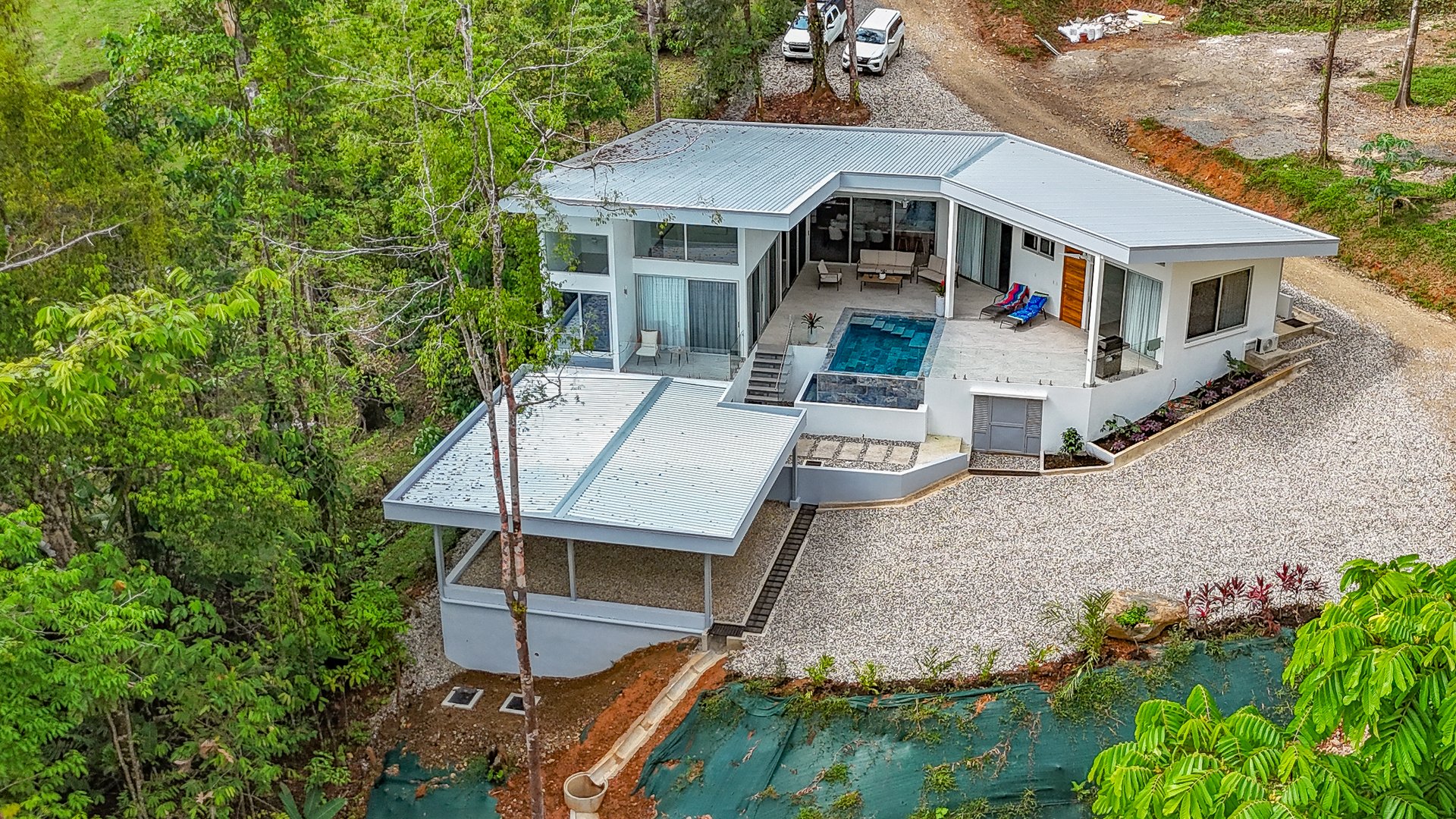 A Huge Rainforest, River & Waterfall Property With TWO Mountain & Jungle-View Luxury Homes on a Massive 4.93 Acre Lot – PLUS an Additional Plantel ready for Development