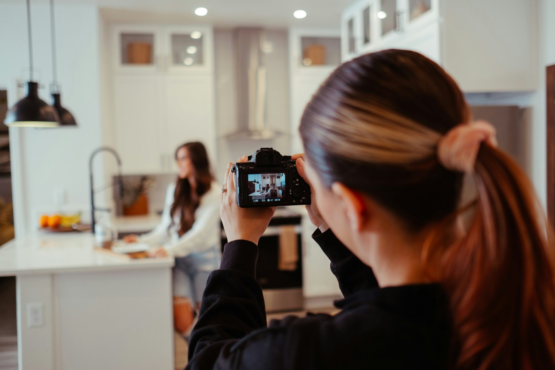 Real estate photographer taking interior photos of a home