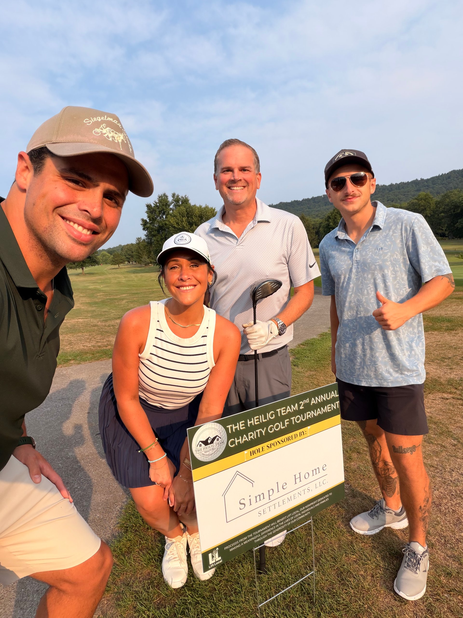 David Becker enjoying a day on the golf course with a group at a charity golf tournament