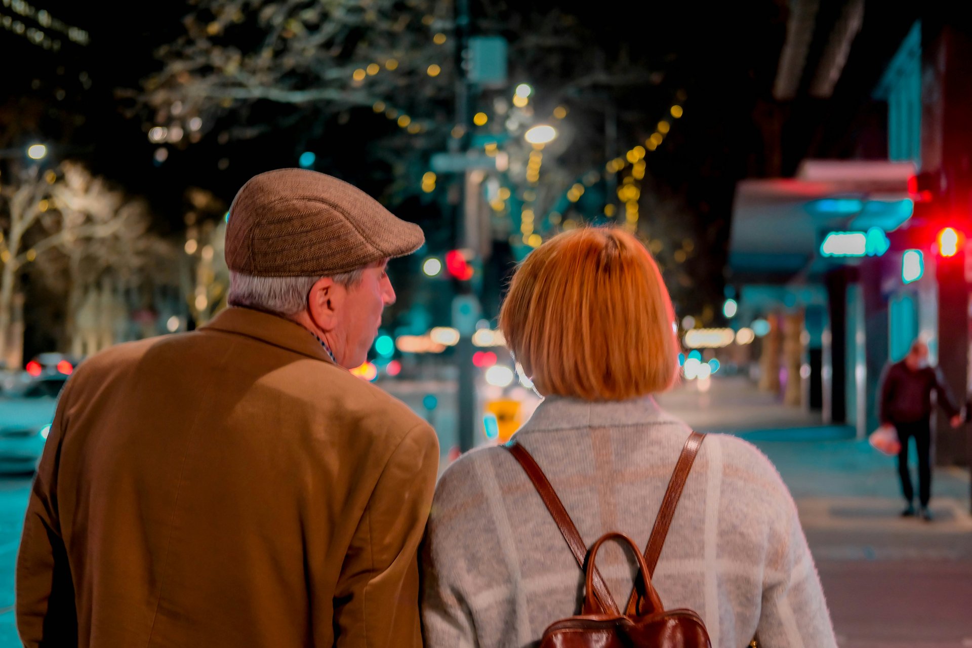 Older couple walking through an urban neighborhood