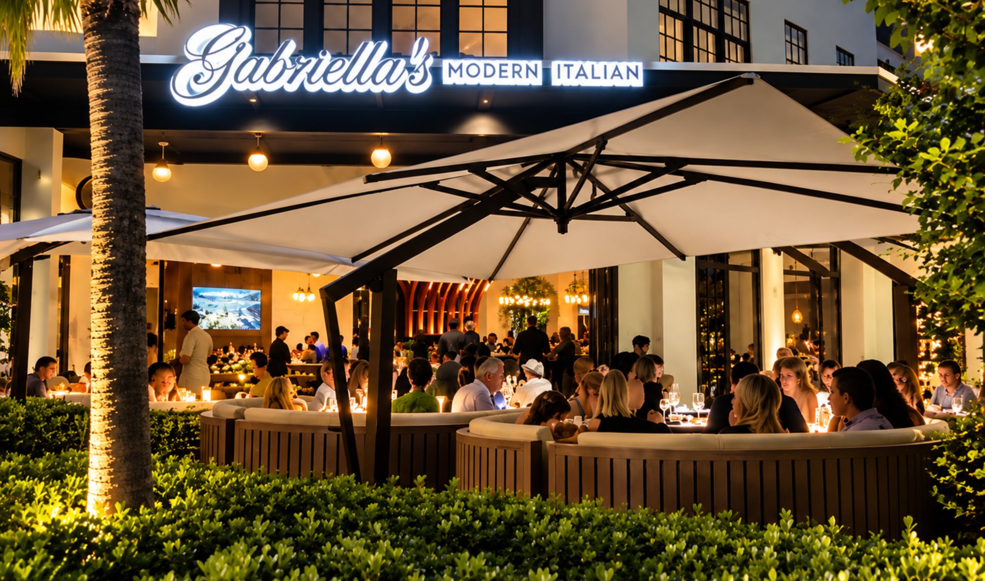 Gabriella’s Modern Italian restaurant, with a busy patio beneath large umbrellas.