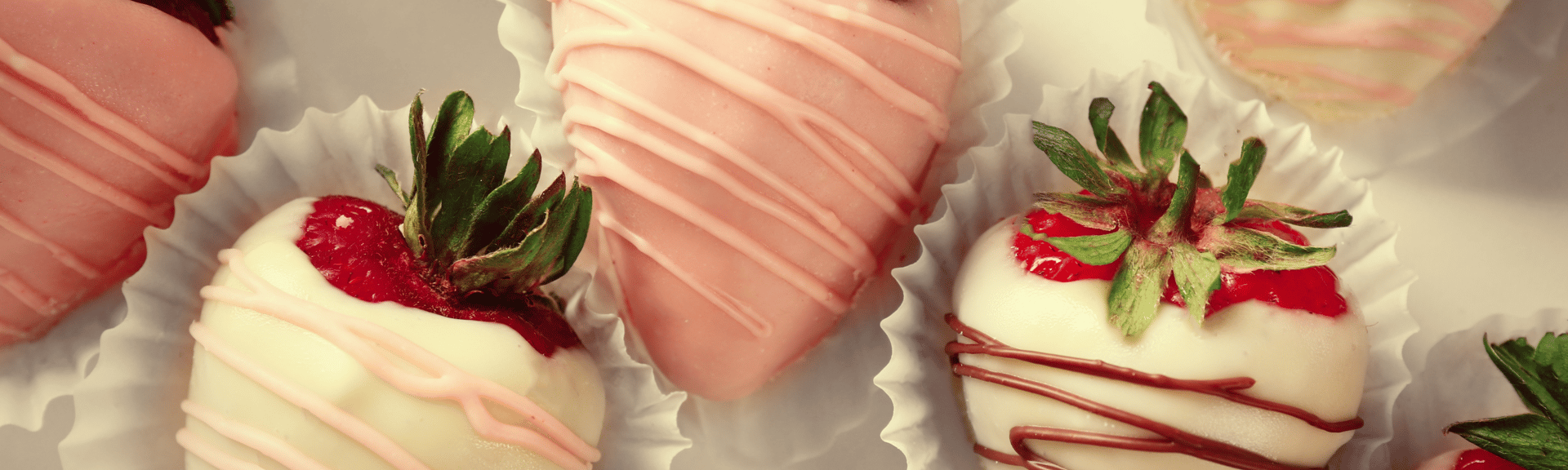 a group of desserts with strawberries on top