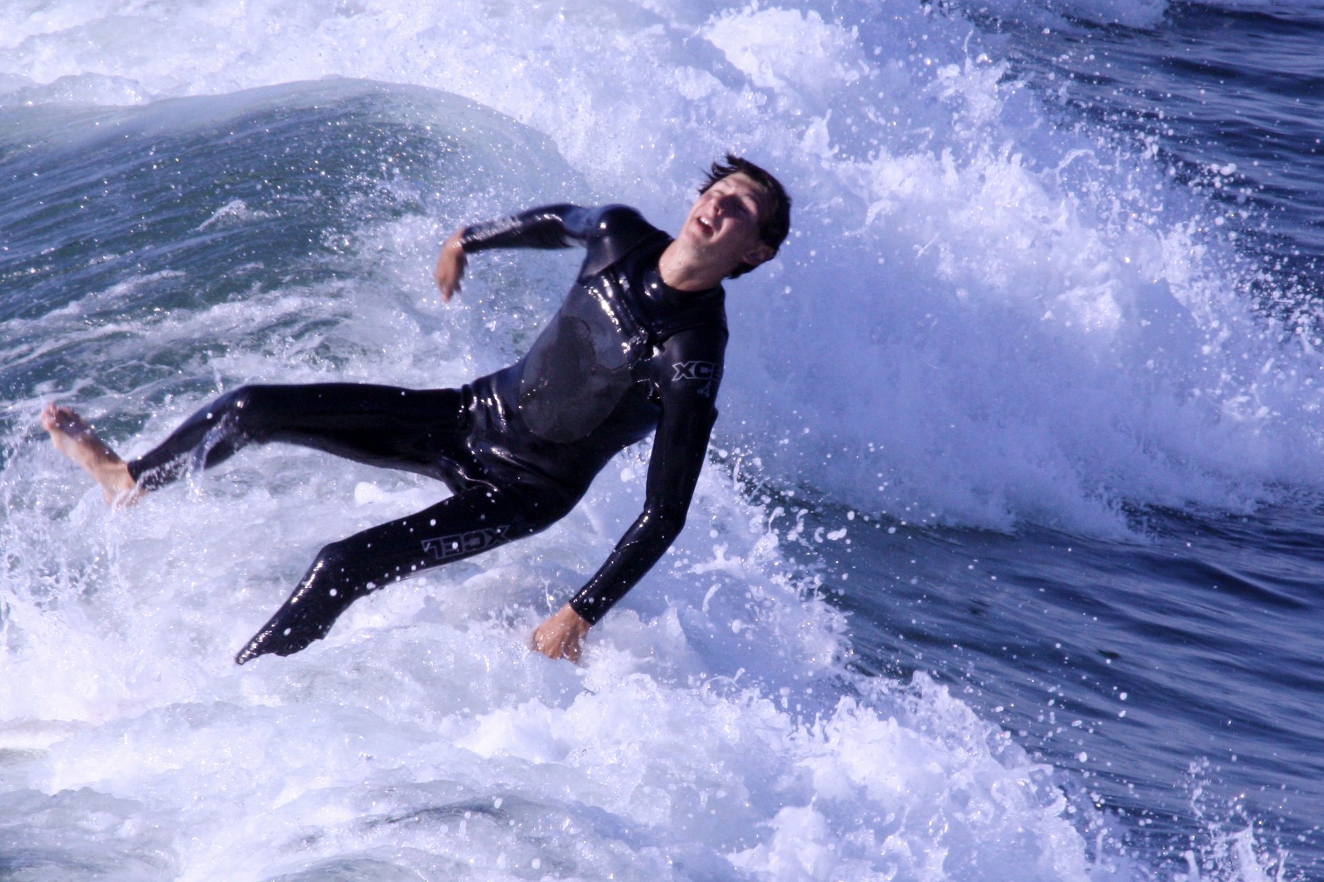 Professional surfers riding powerful waves at Ocean Beach