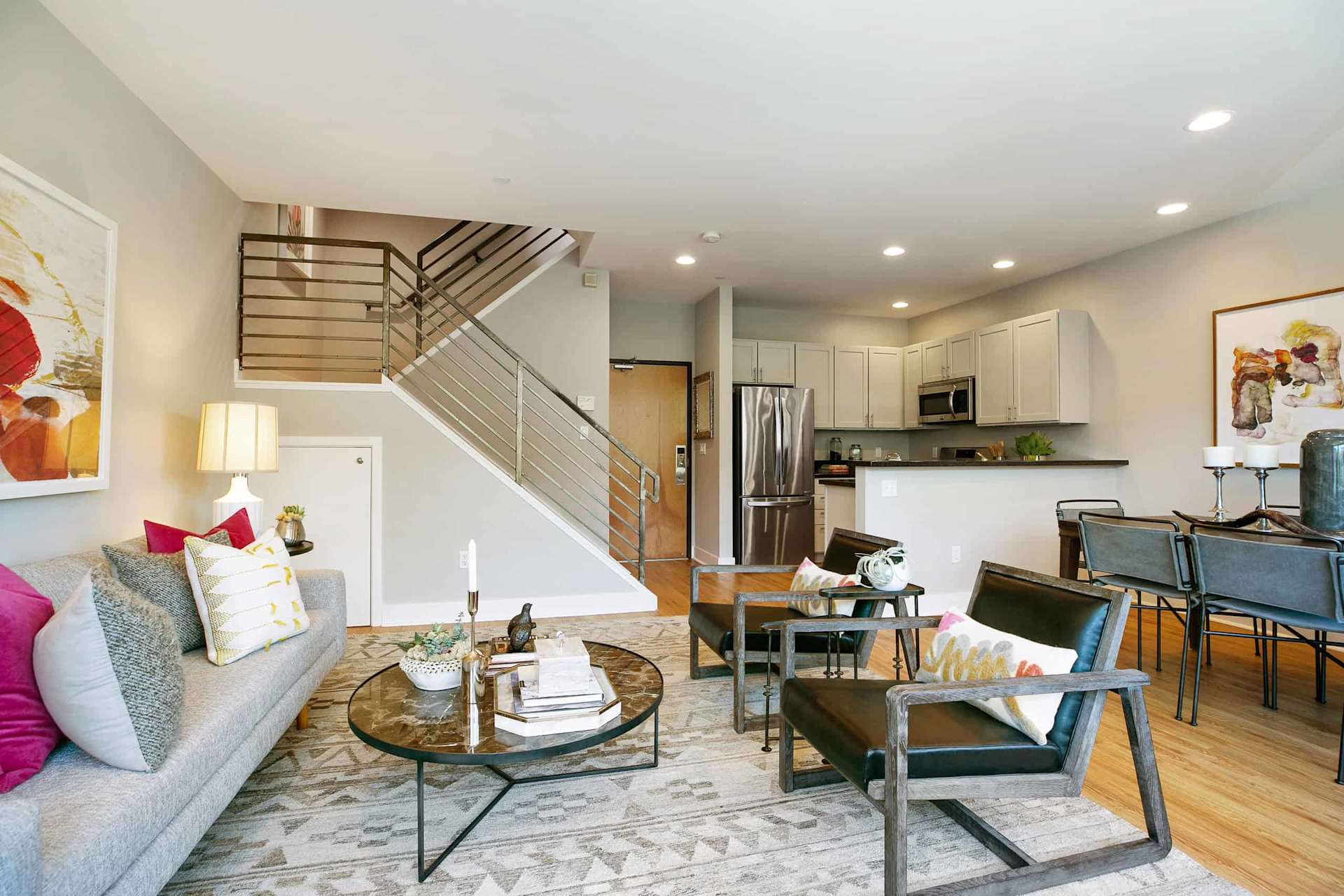 San Francisco home interior with an open living area, stairs, and a separate kitchen zone