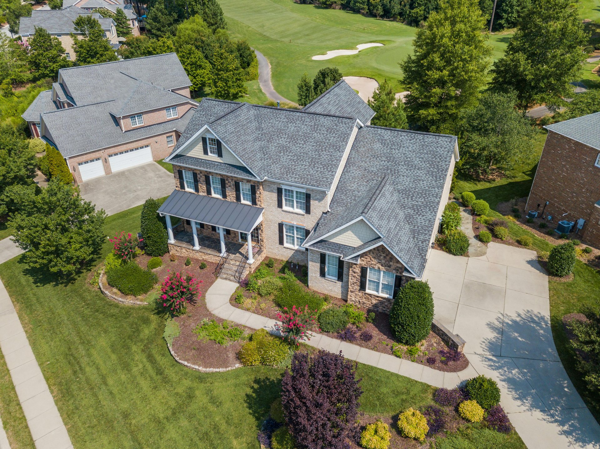 house with green grass lawn