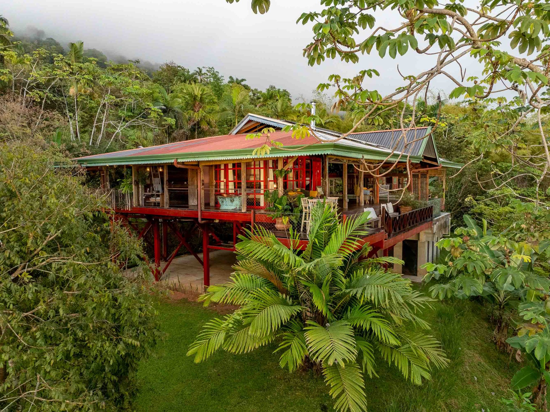 A Handcrafted Residence Immersed in Nature Above the Canopy Ocean View Architectural Home
