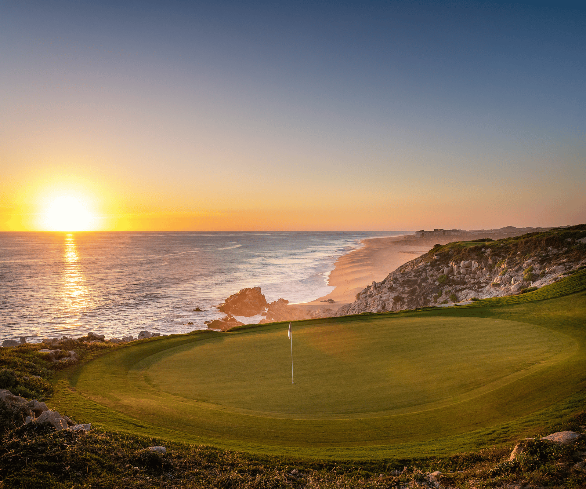 Quivira Los Cabos golf green on the Pacific Ocean at sunset, Cabo San Lucas