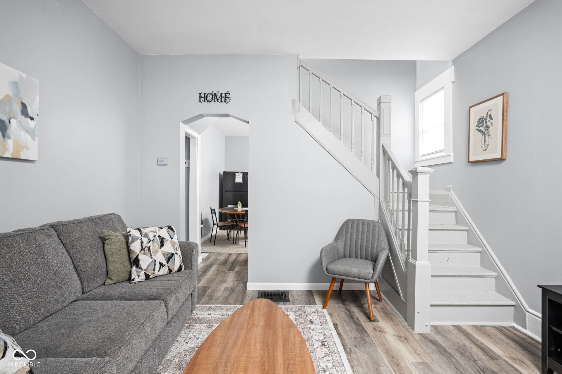 Cozy living room in Indianapolis duplex at 2626 E Michigan St &ndash; warm, open space perfect for relaxation and personalization in the near-east side neighborhood