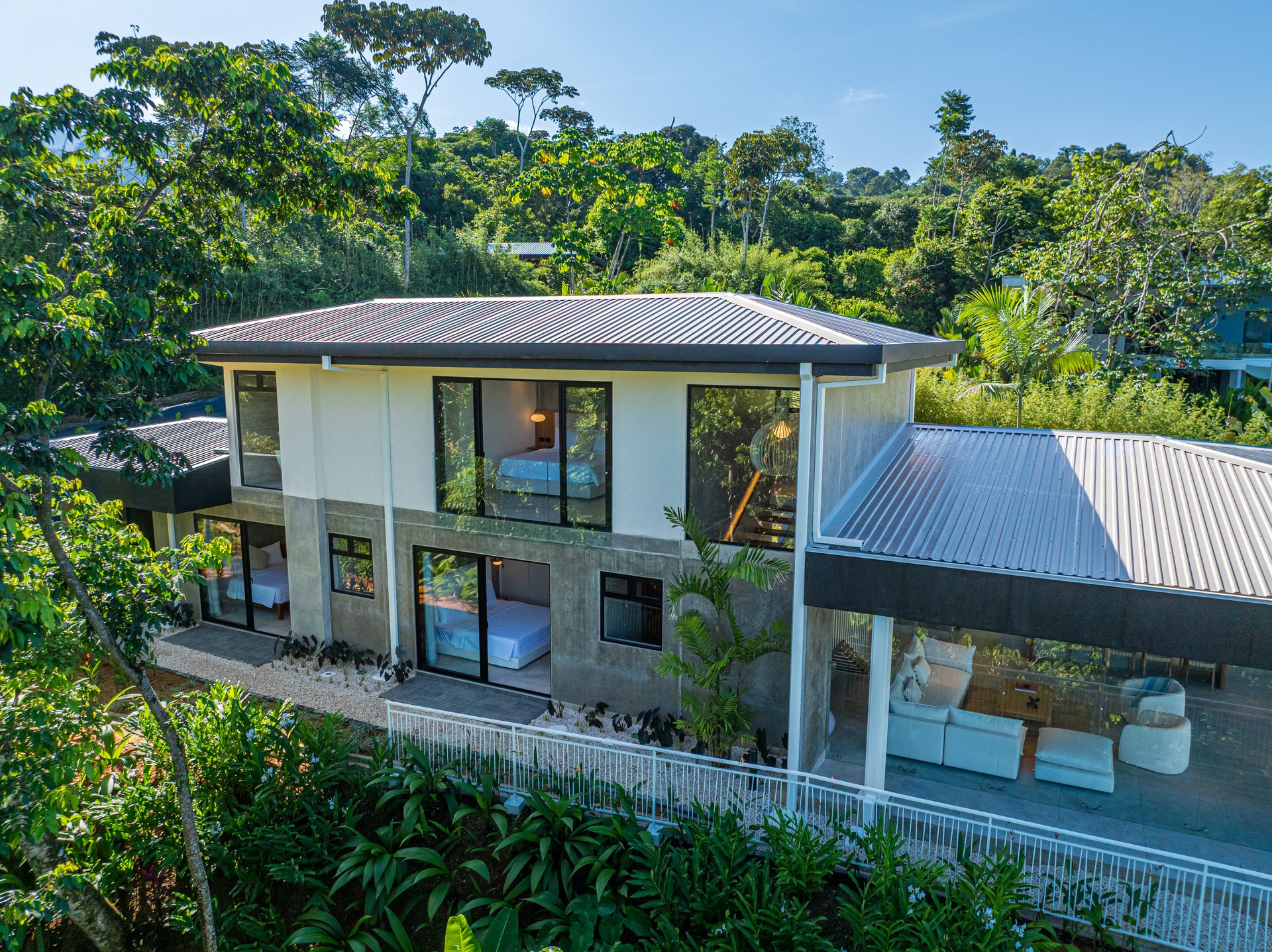 New contemporary tropical villa boasts with a movie theater and views of the iconic whale’s tail