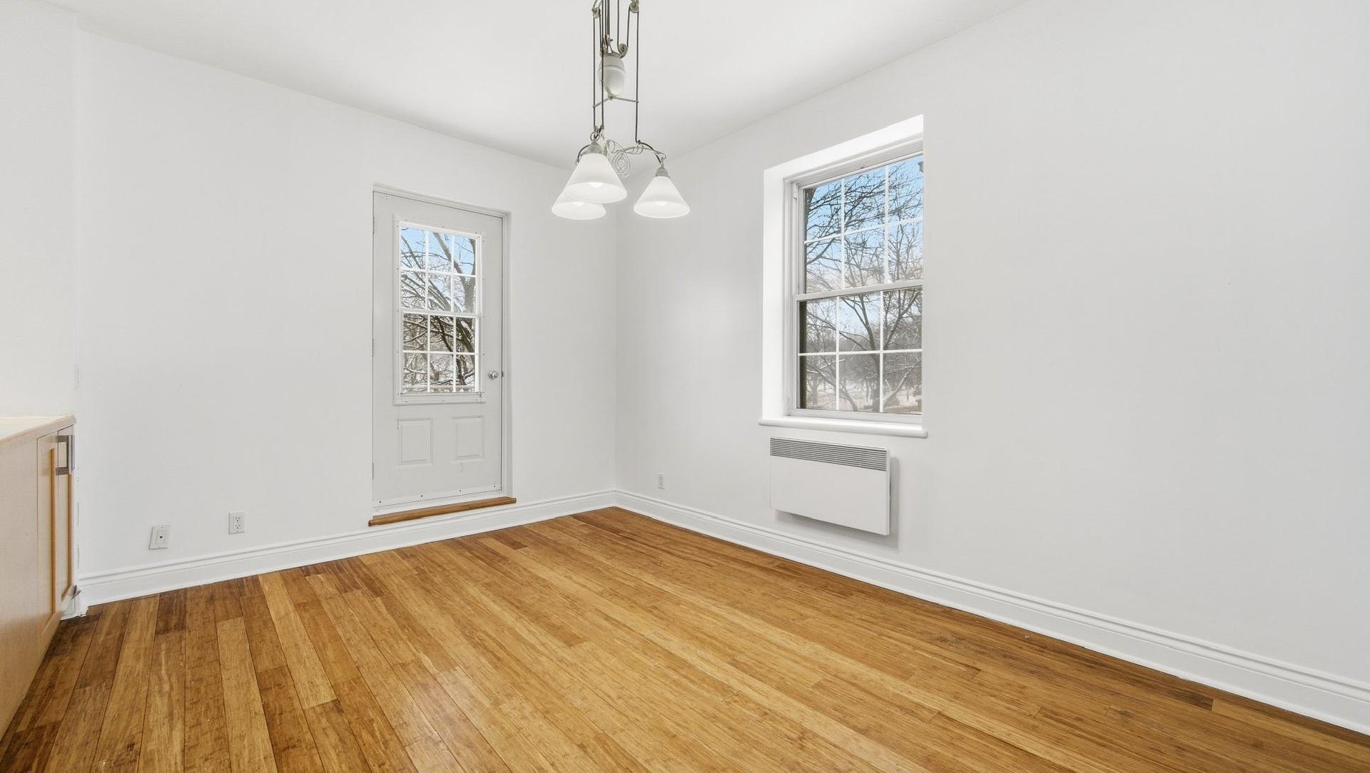 At the edge of Westmount | Corner unit with a view of Mount Royal