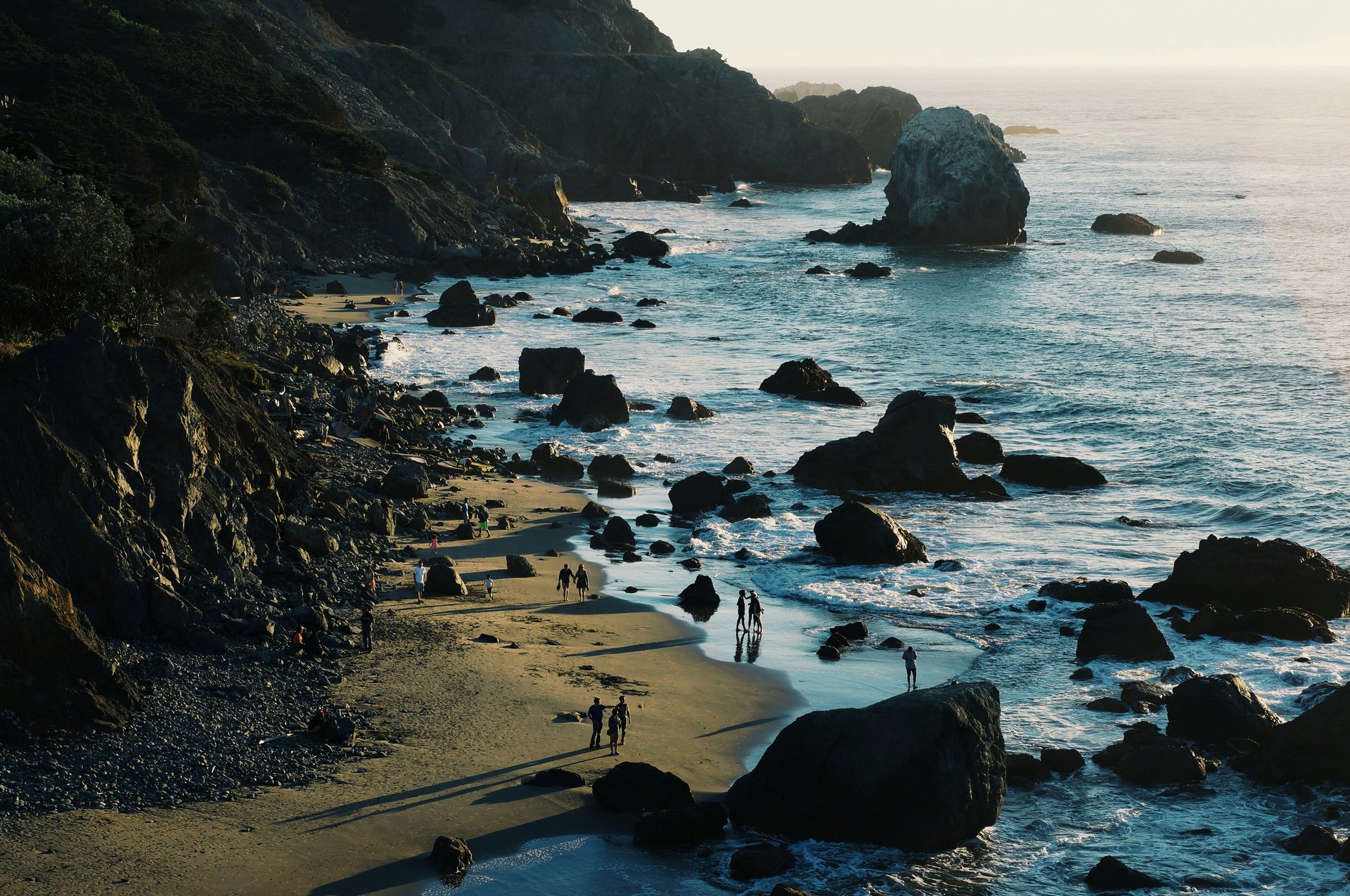 People walking along the coastal trail at Lands End in San Francisco