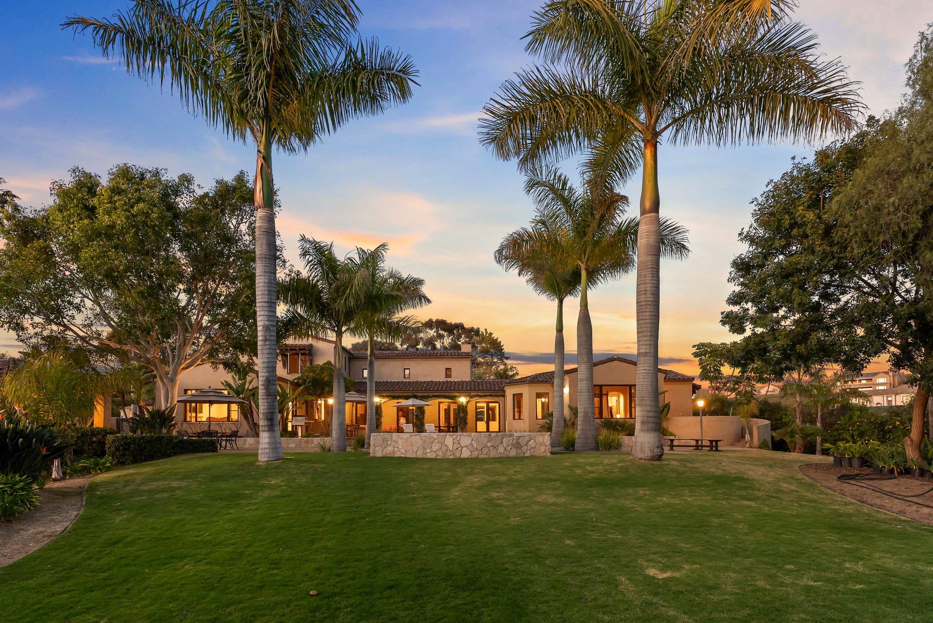 Private outdoor courtyard at 16733 Calle Hermosa with evening lighting