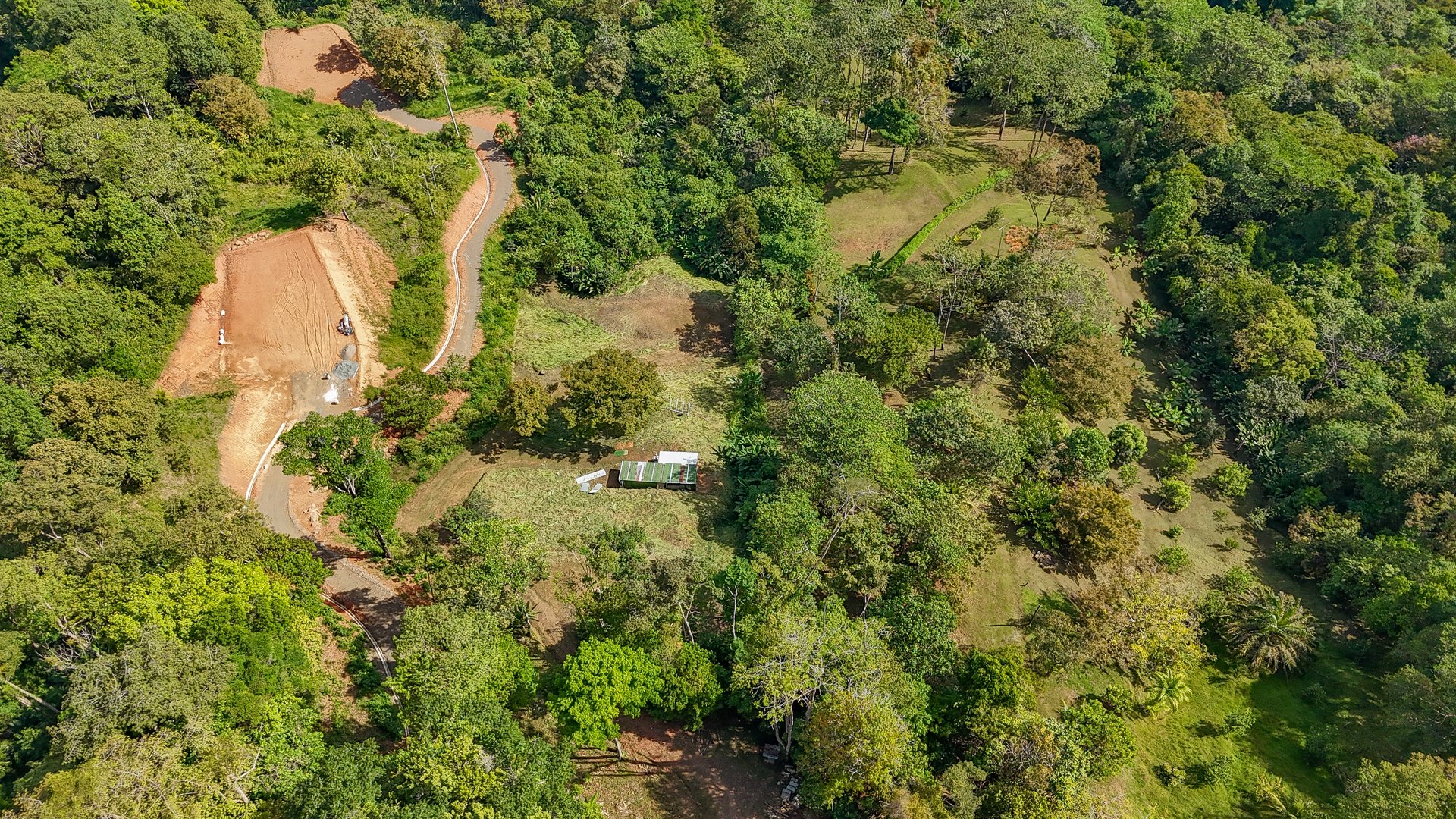 Jungle, Mountain & Valley View Lot with Two Large Plantels, Bordering a Crystal Mountain River with Swimholes & a Waterfall