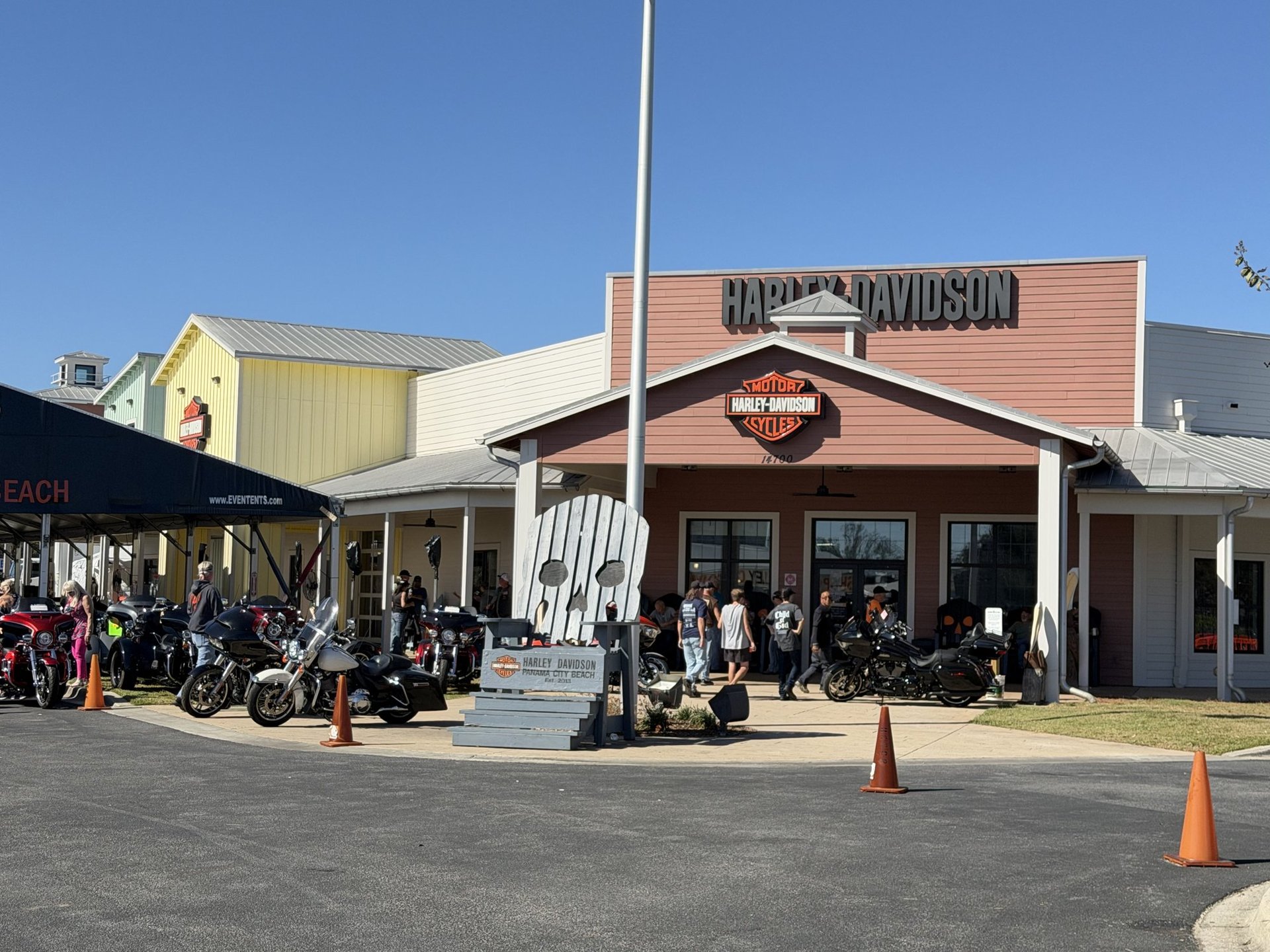 Front of the Harley-Davidson Panama City Beach store with riders and bikes out front